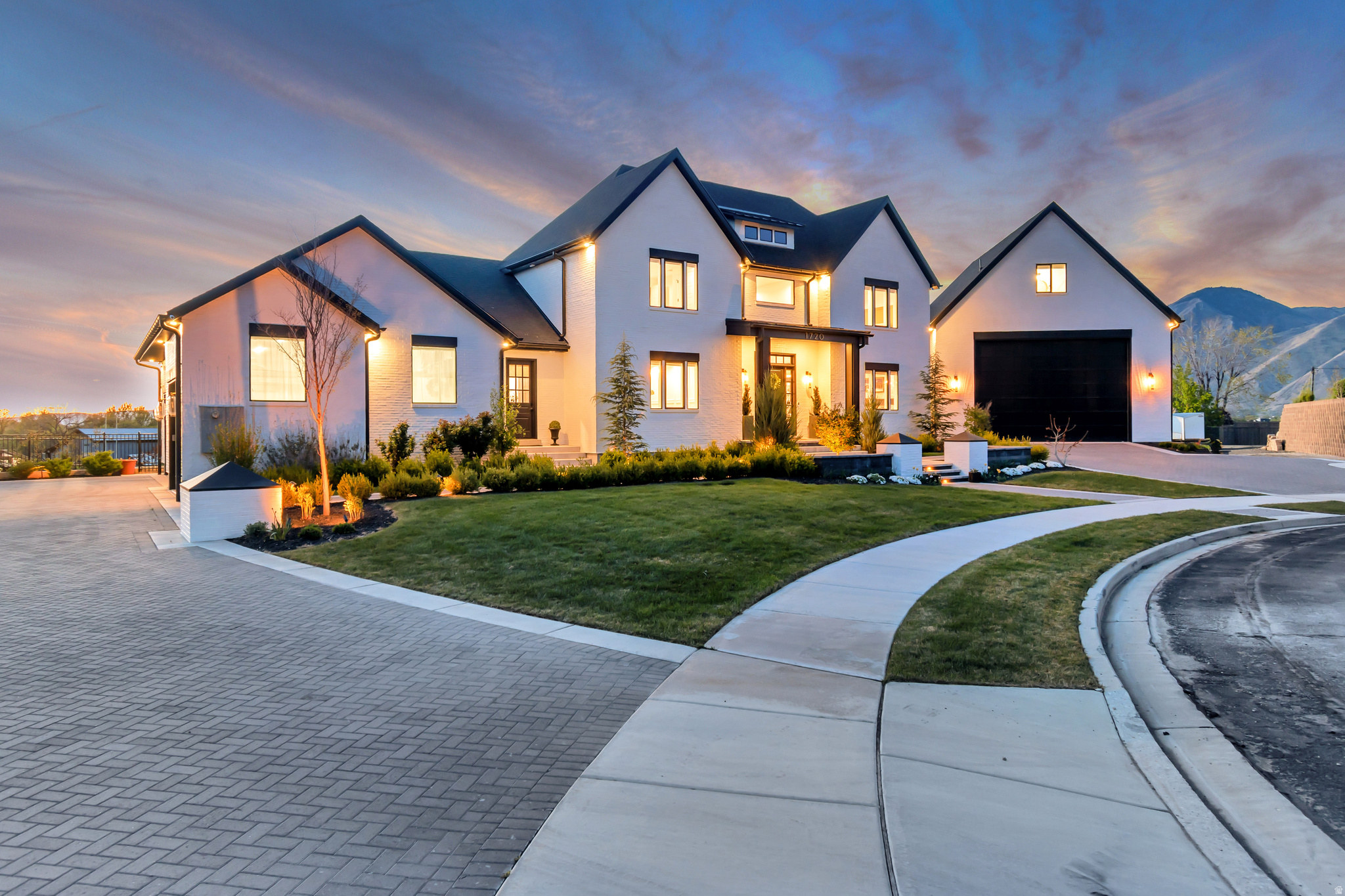 **Ask about our fixed 6.25% Jumbo Loan Payment** Fresh on the market and move in ready! This luxury custom home was built in 2023 by one of Utah's premier builders. Featured in the 2023 Parade of Homes, you will enjoy the luxurious extras and quality designer finishes. All brick exterior, quartz countertops, designer tile, neutral colors, premium cabinets and wood work and solid white oak hardwood flooring throughout. State of the art heating, cooling, insulation and radiant heat systems set this home apart. The interior boasts a gourmet kitchen with butler's pantry, bar seating, roomy dining area all flowing into the vaulted great room. Valley views are framed in by the wall of windows leading out to the covered deck that runs along the entire back of the home. Cozy up to the fireplace or open all four slider panels and let the outside in. The primary bedroom suite boasts balcony access, valley views, double vanities and sinks, oversized steam shower, soaker tub, a closet as big as a bedroom with organization everywhere. You even get your own washer and dryer tucked neatly into the closet built ins. The Flex room and office off the front door entry can't be overlooked. The home office features mountain views, its own fireplace, built in cabinets and shelving, wood paneled ceiling and a wall of glass to keep out noise while feeling open and free. Main floor hosts another half bath along with a laundry for the other bedrooms. Everyone gets their own space with 2 en suite bedrooms upstairs. The 3 car "daily driver" garage is balanced on the other side of the home by the 1,200 sq ft RV garage 40ft in depth with a 16ft high door. Keep your RV and toys out of the elements or build your dream shop in this climate controlled are. Above this larger garage is a 500 sq ft flex room with an attached full bath.  Now on to the not so typical basement. The entire back wall is lined with windows and light. This floor is home to 2 more bedrooms and bathrooms, gigantic family room, 4 person Sauna, 1,200 sq ft Home Gym with extra high ceilings and finally the generous food storage room tucked away behind a hidden door. On to the fully fenced and finished backyard. The garden area contains plenty of garden boxes planted with blackberries, raspberries, grapes and elderberries. House your prize chickens in the designer Carolina  brand name 30ft by 8ft chicken coop. You will want to spend every summer night around the fire pit and hot tub under the oversized gazebo. Compete for gold on the pickleball court with flood lights and a full size basket ball standard. A built in storage are access through a room up garage door holds all your yard and recreation equipment. The side of the home is lined by a driveway from the cul-de-sac down to access the backyard. This home is located in a sleepy bedroom community in the foothills of Mapleton. Minutes away to shopping, medical, restaurants, services and freeway access. Ask to see it today! Buyer to verify square footage, derived from Builder plans, square footage must be verified by buyer.