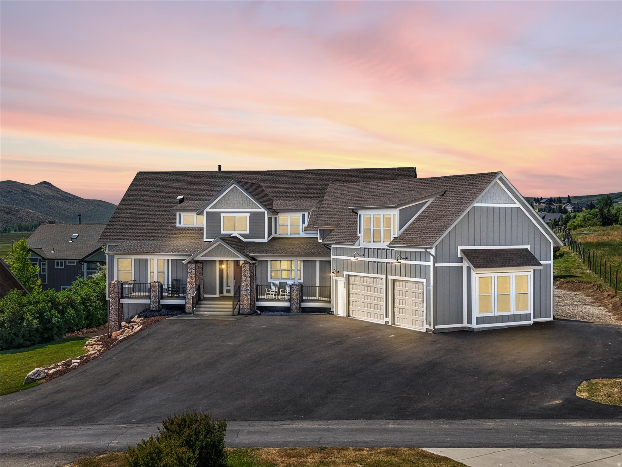 Custom luxury home in beautiful Bear Lake, designed for large groups, family reunions, retreats, and year round recreation! Sleeps 35 comfortable.  This exceptional property offers expansive gathering spaces, and beautiful lake and mountain views. Home features a welcoming covered porch, stone accents, oversized garage, expansive decks perfectly positioned to enjoy Bear Lake's stunning scenery.  Comes fully furnished,  with two fully stocked kitchens, two laundry rooms, 5 ensuites, central air and a cozy wood burning stove. Upstairs family room currently being used as an additional bedroom/ensuite. Short term rentals allowed. Close to Bear Lake Golf Course, bike path, ATV trails, restaurants, Bear Lake State Park Marina and 15 min to Beaver Mountain Ski Resort. An outstanding investment opportunity, private retreat, or vacation rental in the heart of Bear Lake!
