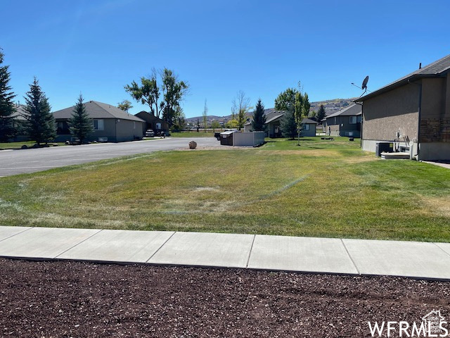 BEAR LAKE BUILDING LOT--- FLAT, Located in private and quiet community of The Cottages with paved roads Borders huge common area and overflow parking, paved walking/bike path runs right by The Cottages, WALK TO THE BEACH. All utilities are stubbed. Across from Pickleville Playhouse, minutes to Bear Lake Golf Course, downtown Garden City and Bear Lake State Park Marina.  Hodges Canyon Trailhead is just to the NW for ATV/UTV, snowmobiling, hiking. Beaver Mountain Ski Resort 20 minutes.