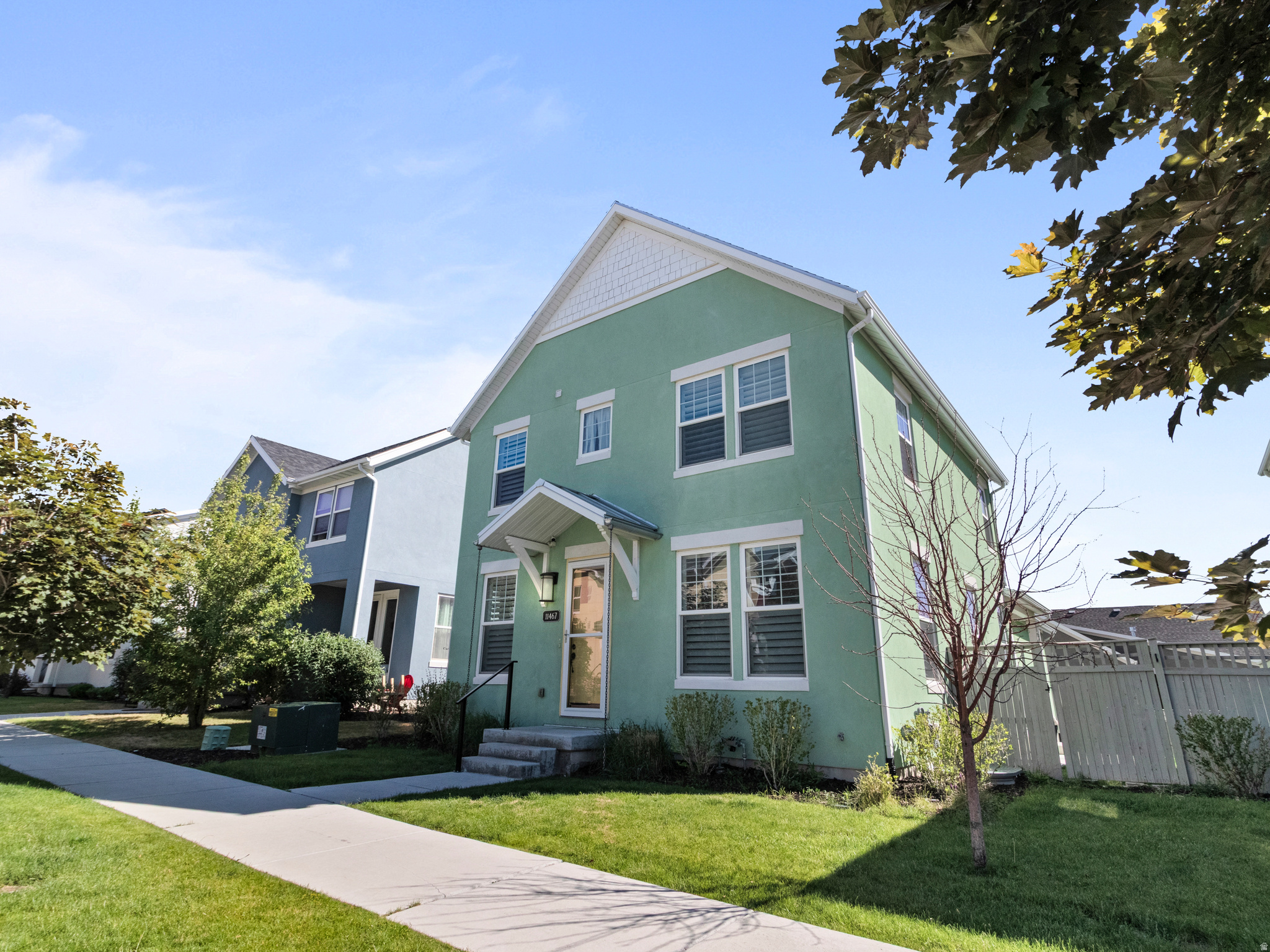 New Daybreak home just a short walk to Biscott's and the community pool! Thoughtful upgrades throughout, including matching new kitchen appliances, JellyFish exterior lighting, a patio plumbed for a gas grill, and a second laundry area in the basement. The open floor plan features 9-foot ceilings on both the main level and basement. Kitchen has all LG ThinQ applainces, double oven, white soft-close shaker cabinetry, a custom range hood, porcelain farmhouse sink, and a butler's pantry with a second prep sink/wet bar with garbage disposal. The spacious primary suite showcases vaulted ceilings, a barn door leading to the luxurious ensuite bath, a Euro glass shower, and a relaxing soaker tub. Additional upgrades include black iron stair railings, an oversized sliding glass door connecting the living room to the covered porch, and a beautiful gas fireplace as the focal point of the living space. A rare combination of thoughtful design, functional upgrades, and Daybreak lifestyle amenities-this home is one you won't want to miss.