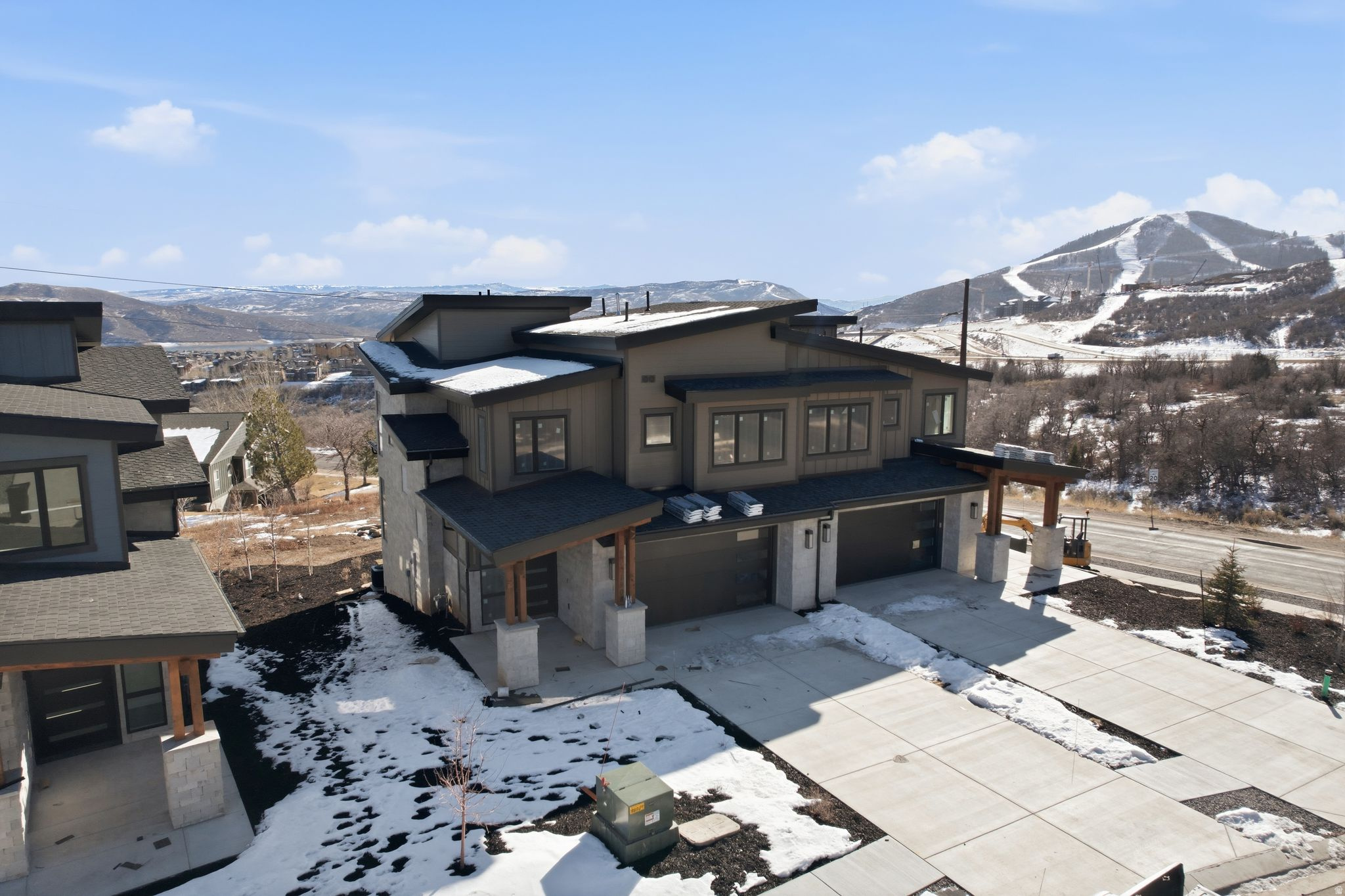 Welcome to Keetley Ridge at Deer Valley East Village! The Powder floorplan/lot 15 is an exceptional end unit offering an unparalleled living experience. Just 600 meters from the Jordanelle Express Gondola, which provides access to the renowned Deer Valley Resort, Keetley Ridge boasts breathtaking panoramic views of the mountains and ski runs to the west, and the Jordanelle Reservoir to the east.  This is your opportunity to own a luxurious townhome just minutes away from the upcoming ski beach at Deer Valley East Village, set to debut in the 2025 ski season. With high-end finishes and ample garage space, this home is perfect for outdoor enthusiasts. Enjoy direct backyard access to the Deer Crest and Jordanelle trail systems, offering over 400 miles of terrain for hiking and mountain biking. Spend your mornings on a sunrise hike or bike ride, and your afternoons boating or paddleboarding on the Jordanelle Reservoir.  The planned commercial area across the street adds to the luxury and convenience of living at Keetley Ridge. It will feature local restaurants, a neighborhood grocery, and various shops and office spaces, providing essential amenities for both residents and guests.