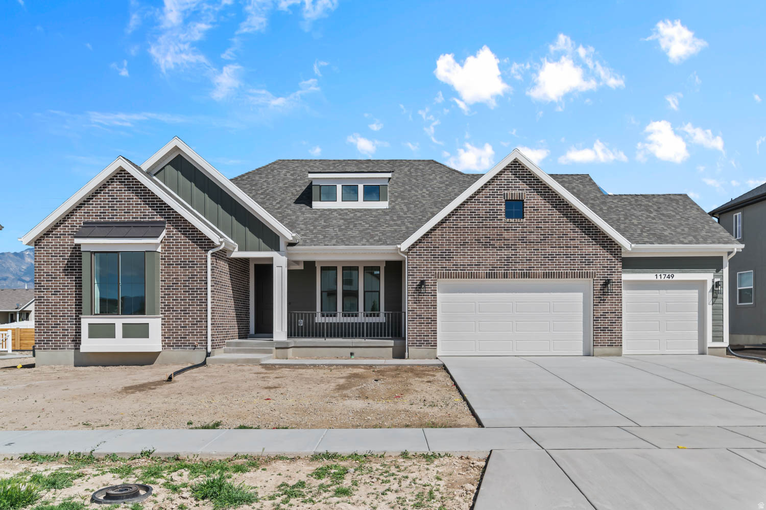 The Carlisle Traditional combines timeless elegance with modern comfort in a great community! The gourmet kitchen features Bluff Maple cabinets with LED lighting, complemented by sleek Quartz countertops and Stainless Steel Cafe Gas appliances, including double ovens for the ultimate cooking experience. Beautiful laminate hardwood flooring flows throughout the main living areas, with tile in wet spaces and soft carpet in the bedrooms. The open and inviting Great Room is centered around a Gas Log Fireplace, providing the perfect place to unwind. Thoughtful touches throughout the home include can lighting, Christmas light package, and black matte hardware. The home also features 9-foot foundation basement walls, a spacious 3-car garage with an exit door, and a large expanded deck perfect for entertaining. The tile surrounds in bathrooms, textured walls, and two-tone paint add sophistication, while the Roosevelt base and casing enhance the home's classic charm. Additional features include gas lines to the dryer and BBQ and a radon ventilation passive system, making this home as functional as it is beautiful.