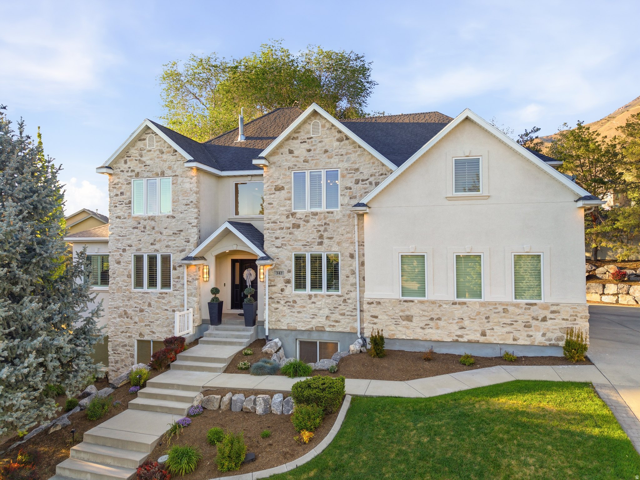 $50,000 PRICE REDUCTION! Creekside at Aspen Grove is a gated, 33-home community around a private 4-acre park. This cul-de-sac home has updated interior and exterior features: remodeled kitchen and baths, new carpet, and new garage doors. In 2020, two high-efficiency HVAC units and a tankless water heater were installed; exterior refreshed Jan 2026. The basement is versatile: usable as a separate living space with a two-bedroom apartment option or integrated with the main level; includes a large storage room and a dance/workout area.  The shaded backyard has mature trees and direct back-yard access to the Murdock Canal with 20+ miles of trails for walking, running, and biking. Manila Pond outside the gate offers walking, a sandy beach, canoeing/kayaking, fishing, pavilion, and fish cleaning station. RV parking.