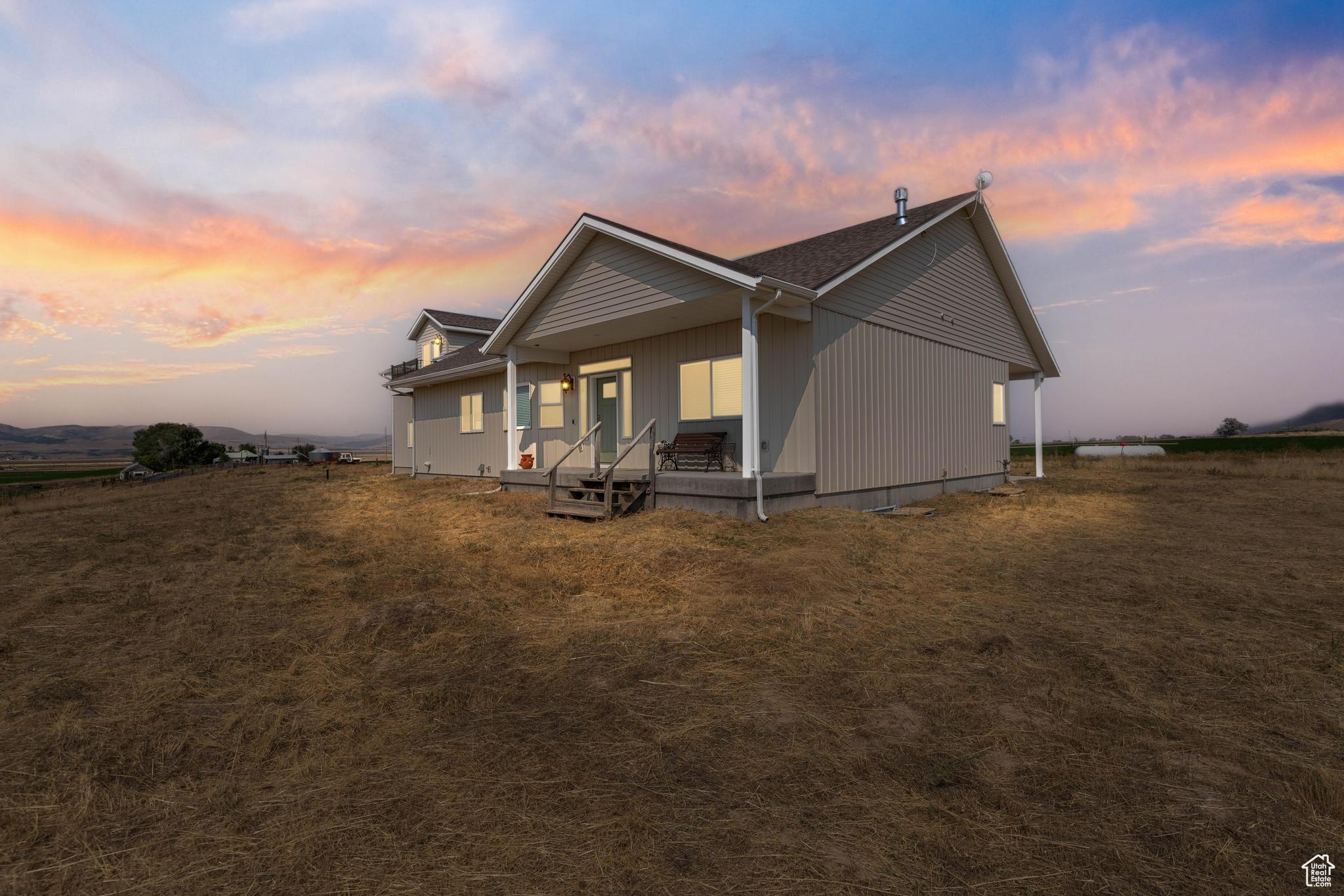 Private 11+ acres with breathtaking mountain views. This 4,181 sq ft home offers 3 bedrooms and 3 bathrooms, including a spacious primary suite with a tray ceiling, his and hers walk-in closets, and a luxurious bathroom with a separate shower and soaking tub. The large, open kitchen features granite countertops and a walk-in pantry.  Both the main floors and basement boast 9-ft ceilings; the basement is framed for two additional bedrooms, a full bath, and a generous family room, with extra storage and a secure safe room.   An oversized attached 3-car garage provides ample parking and workspace. Full RV hookups are available on the cement pad adjacent to the house.  Above the garage, a 500 sq ft ADU offers guest or rental space, complete with a balcony that provides a relaxing atmosphere.  The horse-friendly property features pasture ground, ideal for equestrian pursuits.   You will enjoy the covered back patio or front porch, both offering sweeping views. This property combines spacious comfort, rural tranquility, and endless potential for outdoor living and growth.