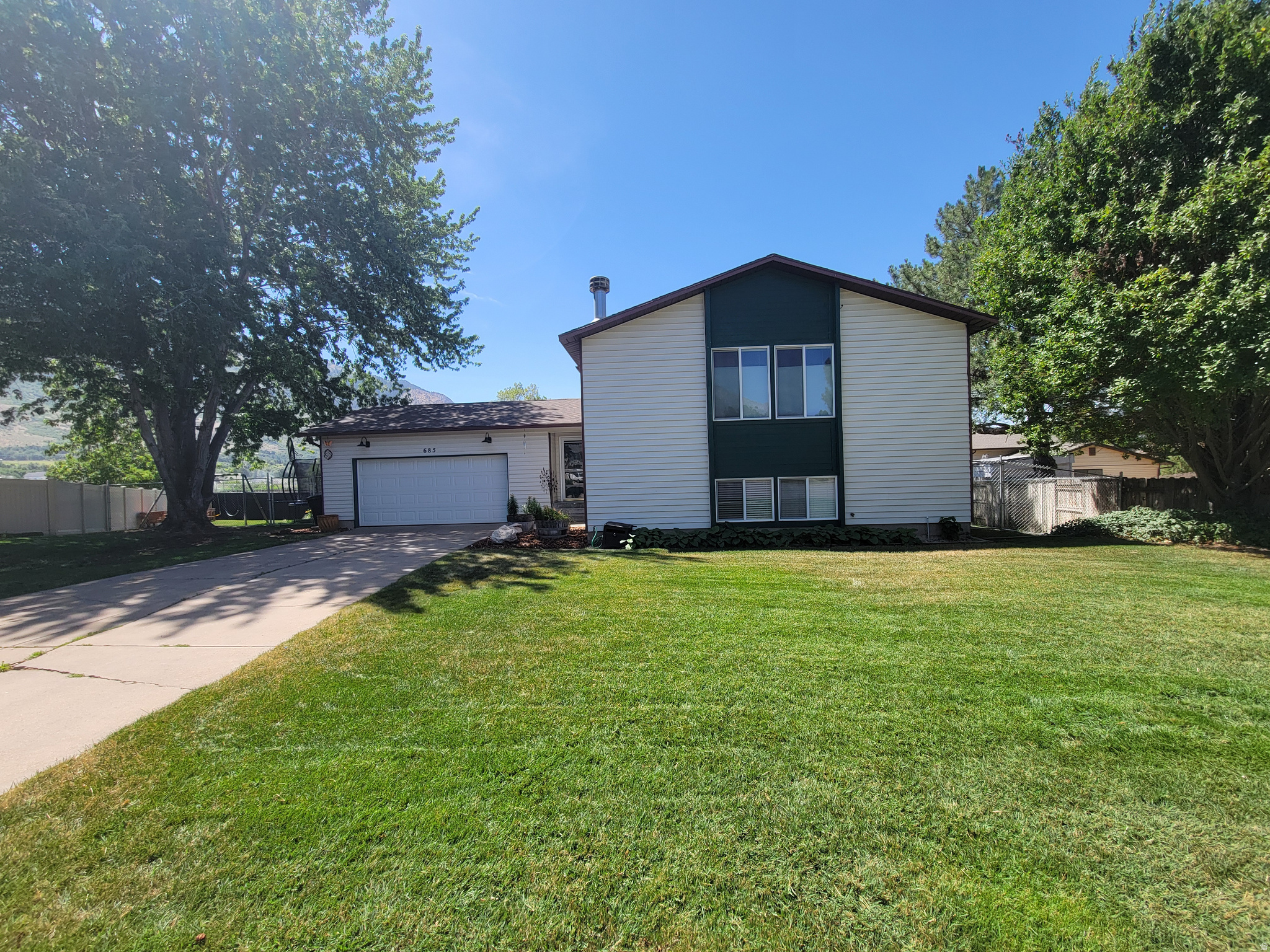 Welcome home! Nestled in a cul-de-sac in a highly desired North Ogden neighborhood, this 3-bedroom, 2-bathroom split-entry bi-level home is perfectly situated to capture stunning mountain views. With a spacious and versatile floor plan, this home offers ample living space for families of all sizes. The upper level features a bright living area with large windows that flood the space with natural light and frame the breathtaking mountain backdrop. The lower level provides additional bedrooms, a cozy family room, and endless possibilities for a home office, gym, or guest space. Enjoy quiet mornings or evening sunsets from the deck or backyard while taking in the panoramic scenery. Conveniently located near schools, parks, and local amenities, this home offers both comfort and an unbeatable location. Don't miss your chance to own this beautiful mountain-view property!  Square footage figures are provided as a courtesy estimate only and were obtained from  County/Builder .  Buyer is advised to obtain an independent measurement.