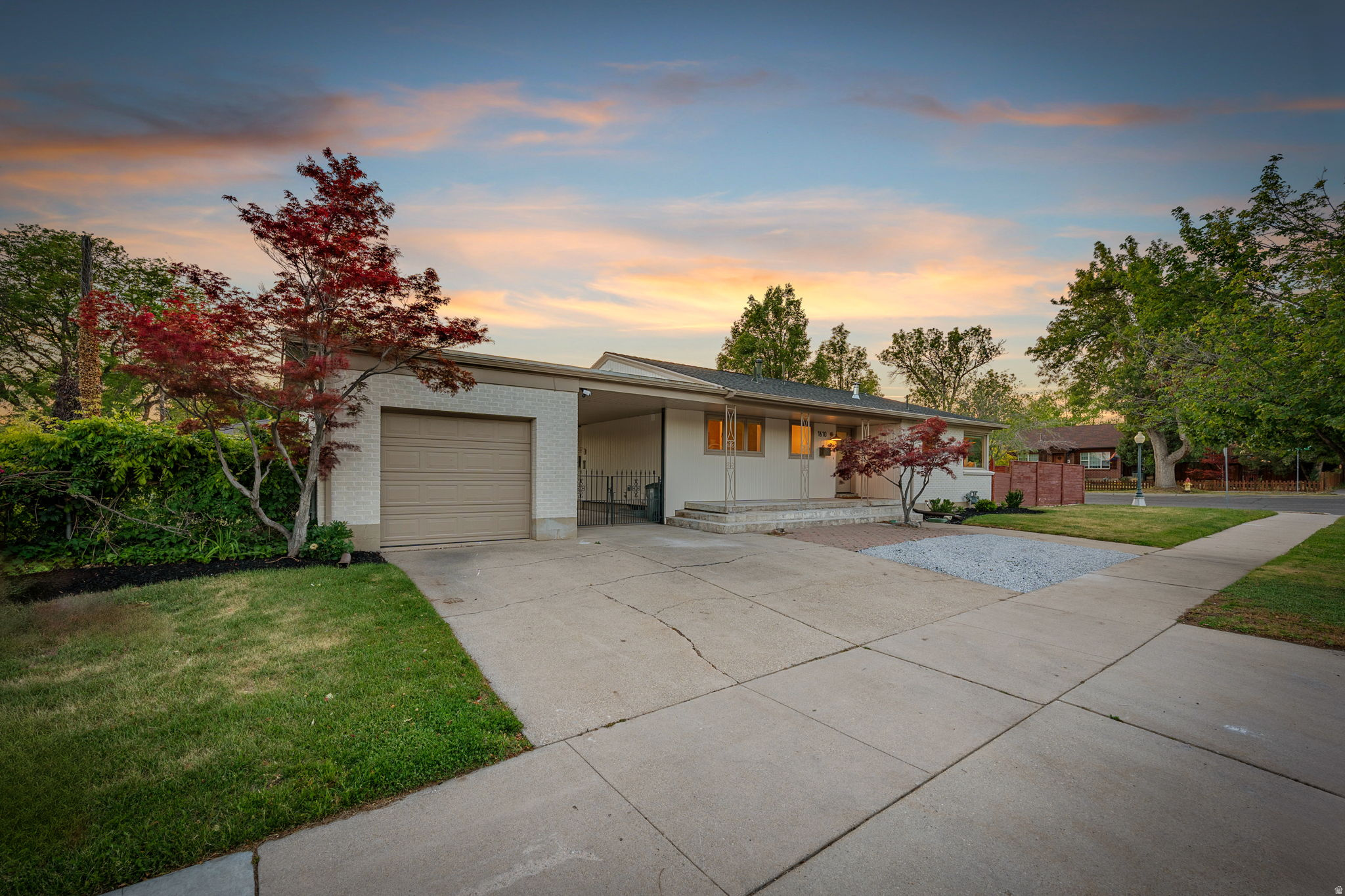 Nestled in the conveniently located and highly desirable Wasatch Hollow neighborhood. Fully permitted and redesigned cozy rambler offers a perfect blend of craftsman charm and modern living to ensure style and functionality. The bright kitchen is appointed with custom caramel oak soft close/glide cabinets, Taj Mahal quartzite counters and pro-grade range. The sun-drenched living & dining areas are equipped with large Andersen windows & doors highlighting the timeless refinished hardwood floors in the relaxed living area. The flexible basement mother-in-law kitchen offers the convenience of multi-generational living or an additional entertaining area. This home also features a main-level primary suite which is a bonus for this area and offers everything needed for single-level living: dual vanities, gorgeous tiled shower, laundry & separate walk-in closets. In total, THREE bedrooms feature their own en-suite baths. The fully fenced backyard features two separate areas: a private sanctuary or entertaining area underneath the pergola and another area for garden lovers, while the simple landscaping and automatic sprinkler system ensures low-maintenance year-round. Enjoy living a stroll away from Wasatch Hollow Park along with all of the neighborhood conveniences that BOTH 15th & 15th and the developing mixed-use 21st & 21st Blocks have to offer including restaurant & wellness options. Minutes to the U of U, Research Park, Sugarhouse, freeway access and skiing, hiking/biking trails. Square footage figures are provided as a courtesy estimate only and were obtained from county assessor. Buyer is advised to obtain an independent measurement.