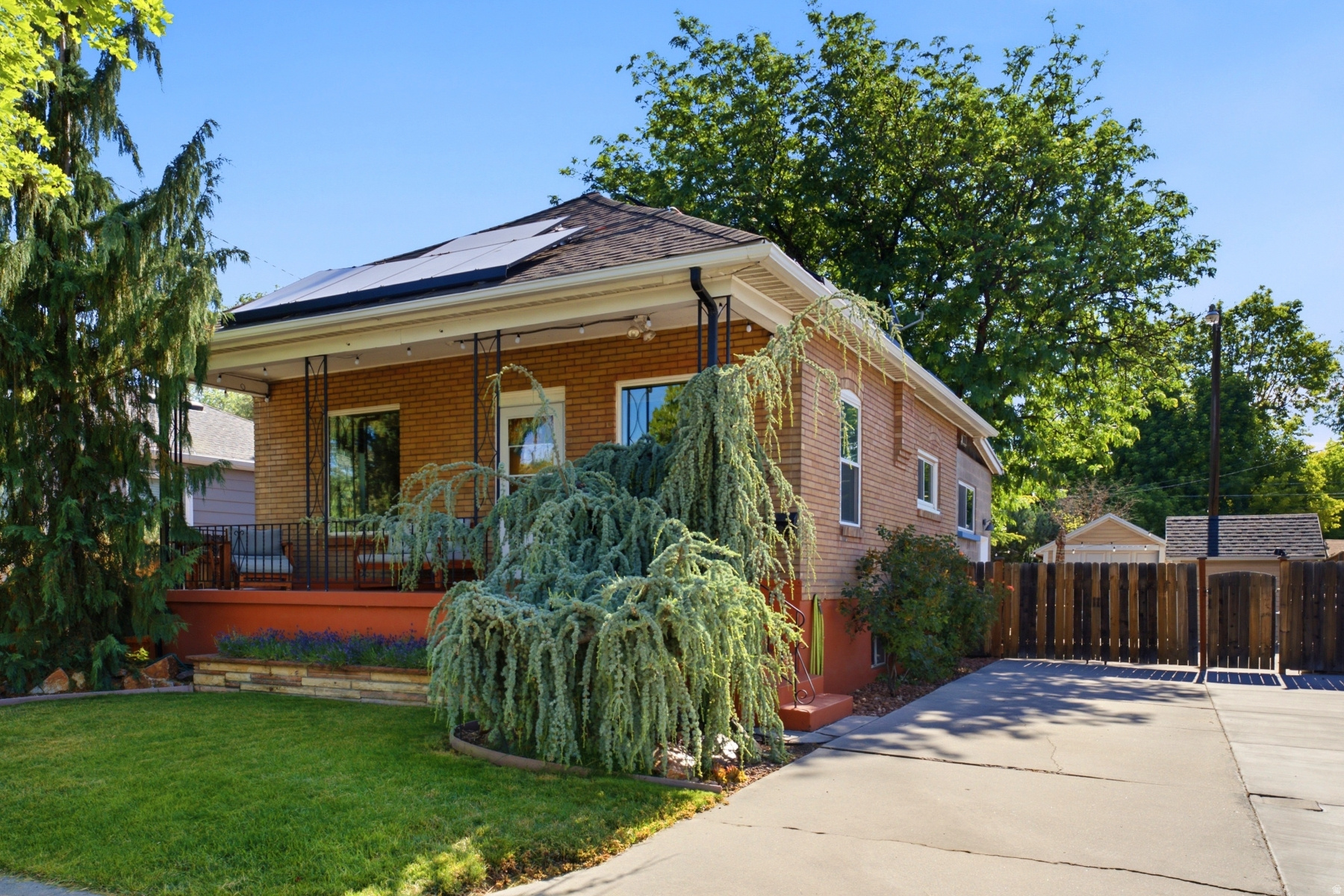 Open House Saturday June 27th from 12 to 2pm. An oasis in a quiet, popular Sugar House neighborhood-just a half block from Nibley Park Golf Course-this turn-key bungalow masterfully blends upgrades with original charm. Inside, this beautifully updated three bedroom, two bath home features exposed brick, bamboo flooring, and a large kitchen equipped with stainless steel appliances and Corian countertops. Energy-efficient boasting paid off solar panel system, triple-pane windows, split-system HVAC, and controlled in-floor radiant heat. Outside, you can relax on the quintessential front porch or retreat to a stunning, meticulously maintained backyard paradise complete with mature trees, low-maintenance turf, a paver patio, and a tranquil pond and waterfall feature. Complete with a storage shed, 1-car garage, and additional off-street parking, this home is a Sugar House gem. Call for your appointment today. Buyer to verify all.