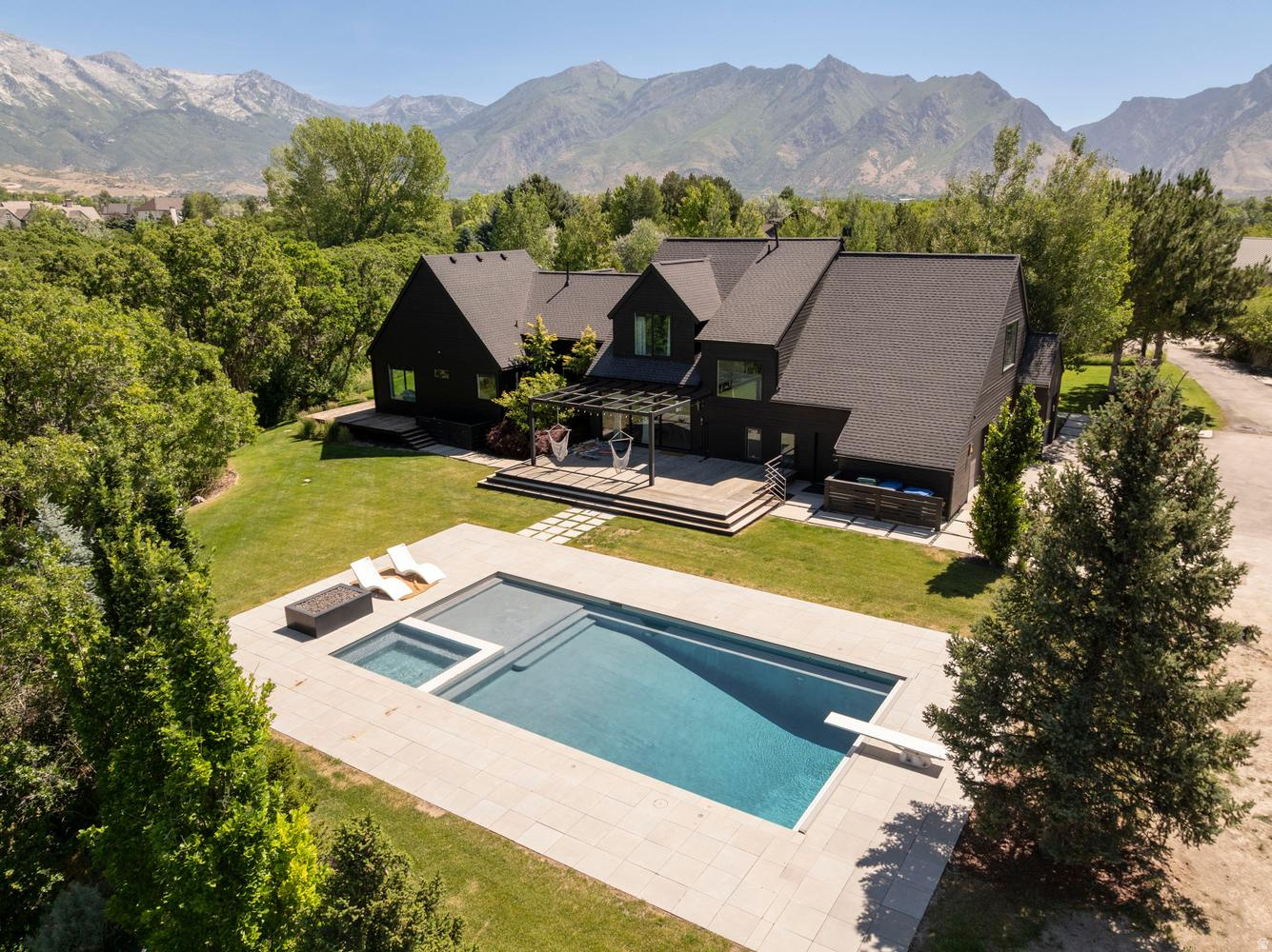 COME AND SEE THE BEST KEPT SECRET IN UTAH COUNTY ~ THIS BEAUTIFULLY REMODELED ARCHITECTURAL MASTERPIECE NESTLED ON ONE OF THE BEST LOTS IN THE NATURAL, PRIVATE AND PEACEFUL RESERVE KNOWN AS BULL RIVER IN HIGHLAND, UTAH! WITH 2.29 ACRES OF NATURAL, WOODED, SURROUNDINGS, THE LOVELY BULL RIVER RUNNING THROUGH THE FRONT YARD, A NEW LUXURIOUS POOL/SPA, PICKLEBALL/BASKETBALL COURT, TRAMPOLINE GRID, PUTTING GREEN AND MORE, YOU'RE GOING TO LOVE THIS SPECTACULAR PROPERTY IN A UNIQUE SETTING WITH 360 DEGREE VIEWS, PRIVACY AND YET PROXIMITY TO ALL THE NORMAL CONVENIENCES OF LIFE! WATCH FOR DEER, TURKEYS, AND OTHER MESMERIZING WILDLIFE. ZONED FOR HORSES! INSIDE YOU'LL FIND A NEWLY RENOVATED, SPACIOUS, LIGHT AND OPEN INTERIOR COMPLETE WITH PRIMARY SUITE, DEN, REMODELED KITCHEN, SOARING VAULTED CEILINGS, LARGE PICTURE WINDOWS AFFORDING PLENTY OF NATURAL LIGHT AND SPACIOUS DECKS OFF THE MAIN FLOOR. THE NEWLY FINISHED BASEMENT HAS AN ADDITIONAL TWO ROOMS, A BATHROOM, A KITCHEN AND ENTERTAINMENT AREA WELL SUITED FOR MOTHER IN LAW LIVING. UPSTAIRS YOU'LL FIND ANOTHER TWO BEDROOMS, A BATHROOM, LOFT AREA AND A FUN REC ROOM COMPLETE WITH TRAMPOLINE FLOOR.  PLENTY OF STORAGE IN GARAGE, OR UNDERGROUND STORAGE BY RECREATION AREA (SPORT COURT, PUTTING GREAT, TRAMPOLINES) ENJOY THE PRIVATE ANNUAL NEIGHBORHOOD BOAT REGATTA OR THE FLOAT DOWN THE BULL RIVER. SQUARE FOOTAGE AND ACREAGE FIGURES ARE PROVIDED AS A COURTESY ESTIMATE ONLY AND WERE OBTAINED BY APPRAISER MEASUREMENT AND COUNTY RECORDS. BUYER AND BUYER AGENT ARE ADVISED TO OBTAIN AN INDIVIDUAL MEASUREMENT.