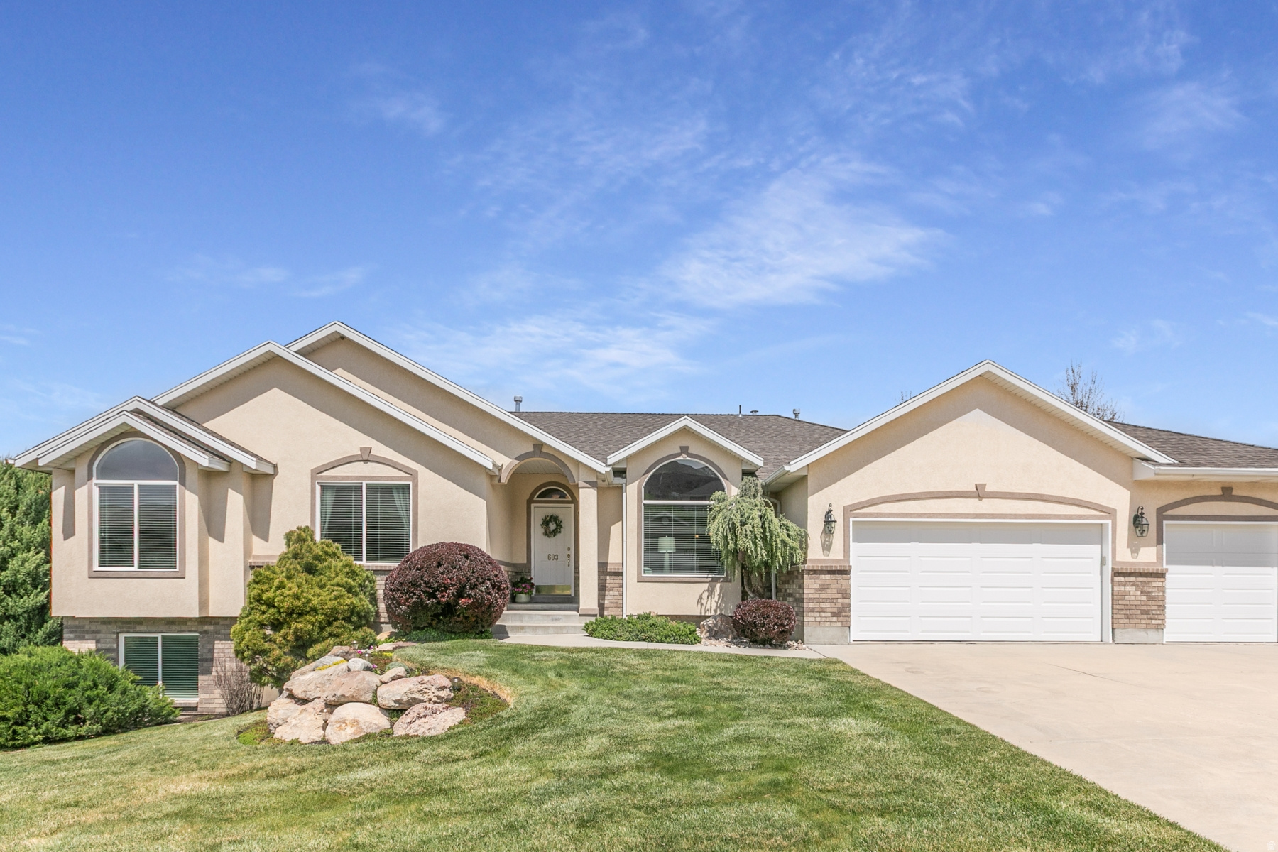 Great Draper neighborhood immaculate rambler on nearly half an acre lot. Large corner lot on a quiet street with south facing driveway.  Backyard fully landscaped has upper deck with natural gas connection for grill, two ground level patios. This home has both beautiful mountain and valley views. This home features a walkout basement with in-law suite that has a full kitchen, living room, bath, laundry, bedroom with basement floor radiant heating. This area could also be used as rental income if you choose to rent. The lot is approved for a large RV detached garage and/or a ADU unit. 48" hallway on main level. Approximate 300 sq ft storage area in the basement, newer 75 gallon commercial dual stage water heater, new insulated garage doors. The home has 2- air and furnace units, all appliance included, full sprinkler irrigation system with 2 owned water shares. The neighborhood has nice walking trails a short distance south and north of the property, and a small neighborhood park.  Shopping close by and easy access to I-15 and Bangerter Hwy for commuting.