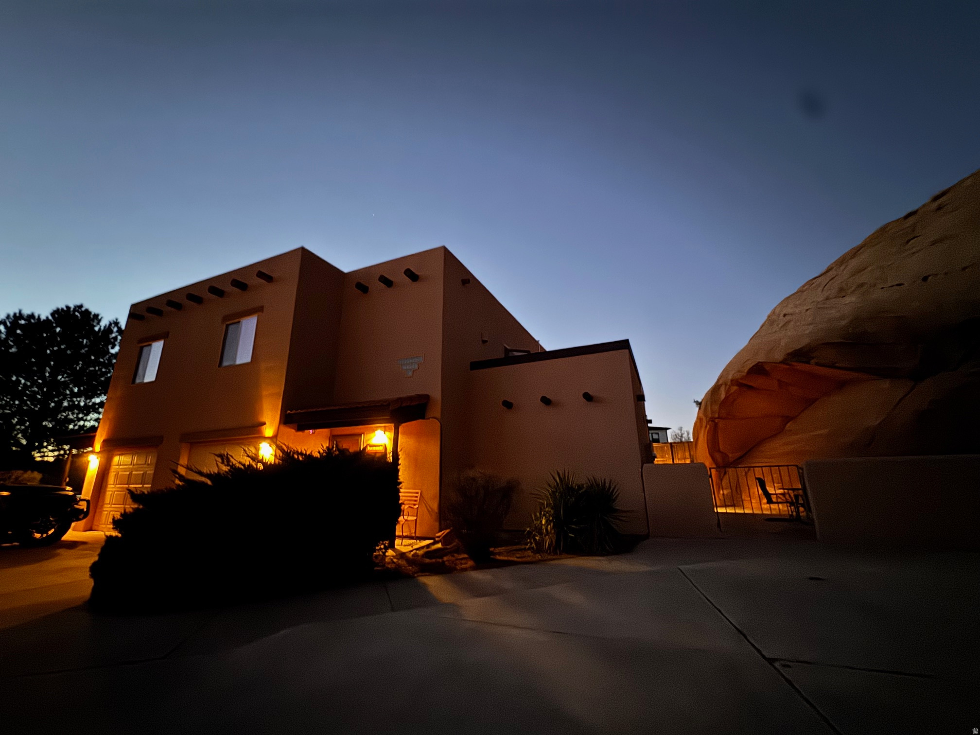 Remodeled nightly rental near Moab Golf Course and Steelbender trail with a large patio backing to a classic sandstone formation and private hot tub. 1759 solar powered square feet on two levels, updated and beautifully decorated with remodeled kitchen. Comes fully furnished (art negotiable), with a one car garage. Enjoy stunning Moab Rim views from the upstairs deck. Minutes to hiking, biking, and off-roading plus quick access to Arches and Canyonlands.   Square footage figures are provided as a courtesy estimate only and were obtained from owner provided appraisal.  Buyer is advised to obtain an independent measurement.