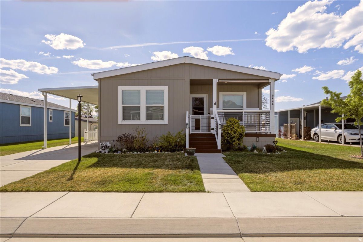 Welcome to easy, low-maintenance living in the highly sought-after Winchester Estates 55+ community in Murray. Built in 2020 and impeccably maintained, this move-in ready home offers the perfect blend of comfort, functionality, and thoughtful design.  Step inside to a bright, open-concept layout where the kitchen, dining, and living areas flow seamlessly together-ideal for both everyday living and entertaining. The modern kitchen features crisp white cabinetry, a spacious island with seating, and ample counter space, all opening to a warm and inviting living room filled with natural light.  The primary suite offers a comfortable retreat, while two additional bedrooms provide flexibility for guests, hobbies, or a home office. The layout is both practical and well-balanced, making the home feel larger than expected.  Outside, enjoy a charming covered front porch perfect for morning coffee or quiet evenings and a rare, fully fenced yard offering space for pets or simply enjoying a bit of privacy. The low-maintenance outdoor setup means you get the space without the upkeep.  Additional features include a covered carport, dedicated laundry area, and generous storage throughout.  Located in a well-maintained, pet-friendly community with convenient access to shopping, dining, and major routes, this home offers a lifestyle that is both easy and connected.  Buyer must be approved by Park Management prior to putting in an offer.