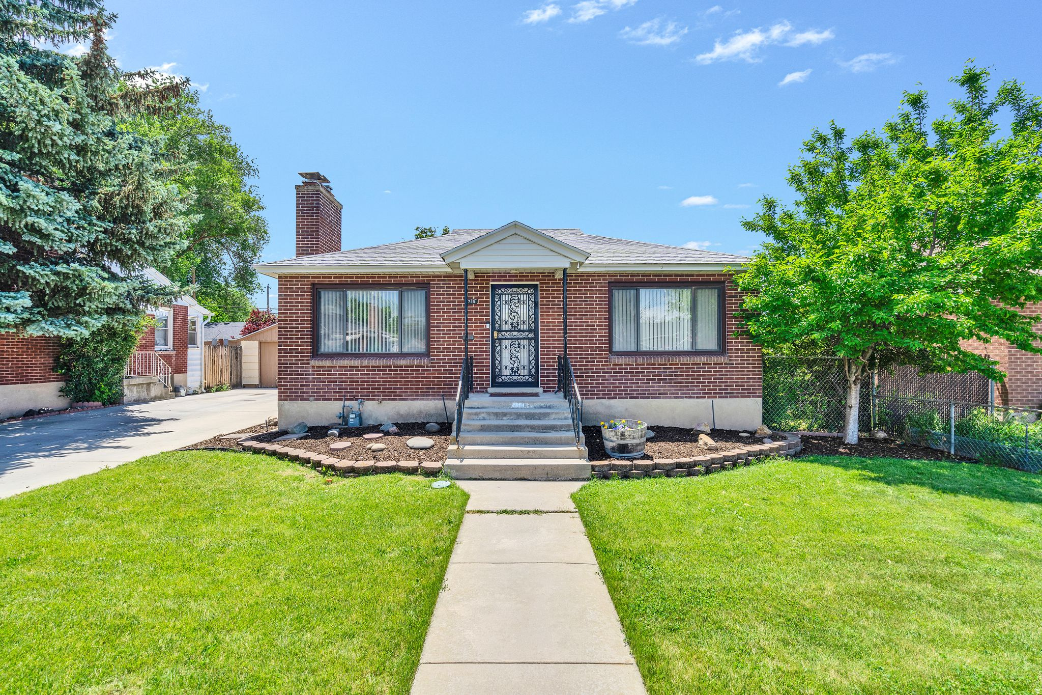 Located in the heart of Millcreek, this well-maintained home offers space, flexibility, and strong long-term value in one of Salt Lake's most desirable east-side neighborhoods. Inside, you'll find a functional layout with multiple living areas, two fireplaces, and great natural light throughout. The kitchen features updated countertops, solid cabinetry, and opens to a large dining area. Recently renovated bathrooms add a clean, modern touch, while original hardwood floors bring warmth and character. The basement offers separate access with clear potential for rental income, house hacking, or multi-generational living. Outside, enjoy a quiet, private backyard, storage shed, and a large detached garage with plenty of room for parking, storage, or workspace. Located just minutes from Sugar House, downtown Salt Lake, and canyon access, this is a strong opportunity for both owner-occupants and investors looking for a solid Millcreek property with upside.