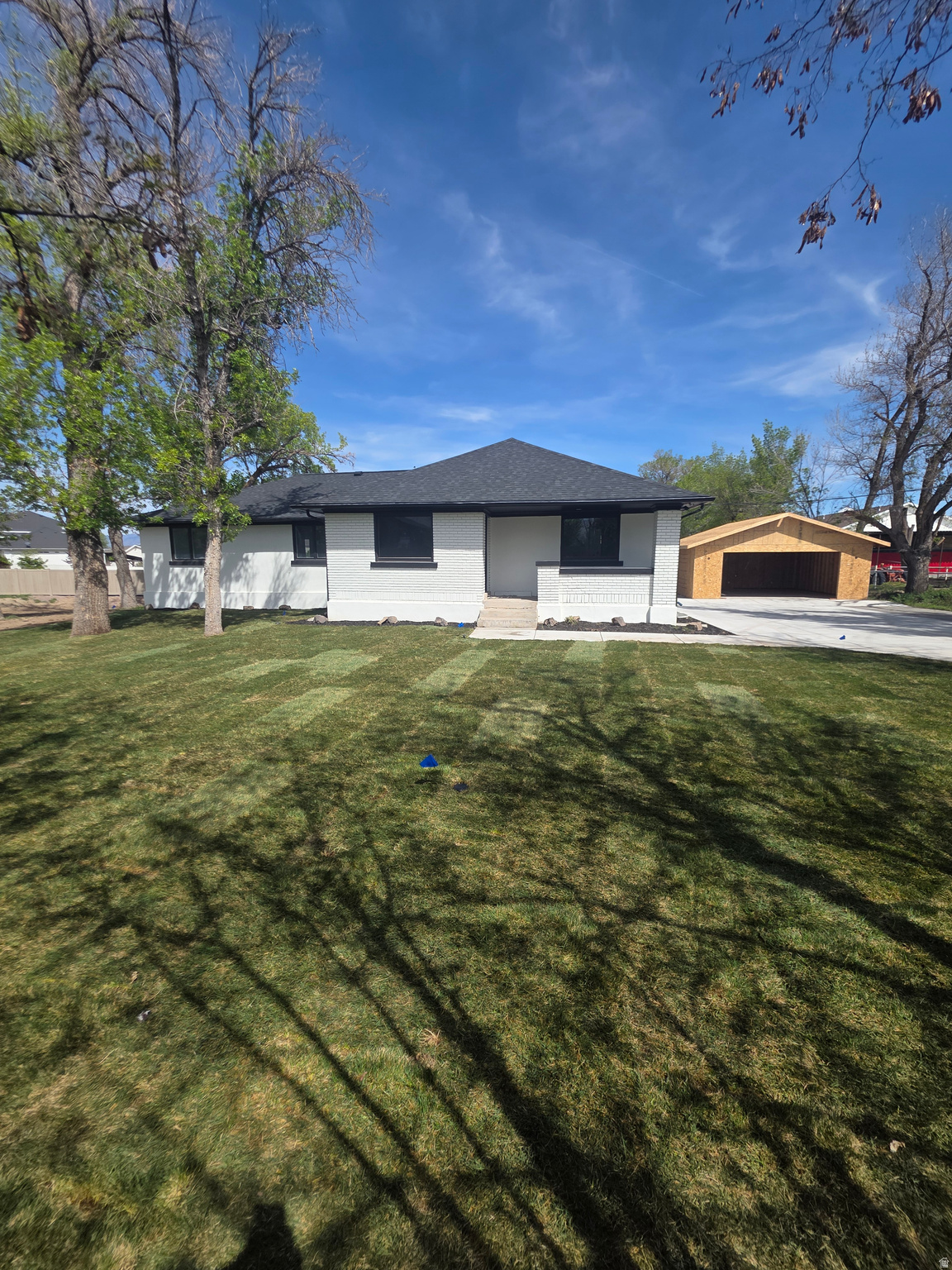 Fully remodeled and move-in ready, this stunning 6-bedroom home sits on a rare half-acre lot in a highly desirable Riverton location. This home offers the feel of new construction with the benefit of space, privacy, and an established neighborhood.  The heart of the home is the beautifully updated kitchen featuring a HUGE quartz kitchen island, custom cabinetry, and stainless-steel appliances including a gas range, perfect for both everyday living and entertaining. The spacious layout offers multiple living areas, a fully finished basement, and flexible bedroom space ideal for a home office, gym, or guest rooms.  Downstairs, the finished basement includes a convenient kitchenette, providing excellent potential for multi-generational living or extended guest stays.  Beyond the cosmetic updates, major system upgrades have already been completed, including a new roof, new furnace and A/C, and a new water heater, offering peace of mind for years to come. The home also features all new flooring, cabinetry, and finishes throughout, along with beautifully updated bathrooms showcasing custom cabinets and tile showers.  The primary suite offers a private retreat with its own deck, perfect for relaxing and taking in the surrounding mountain views. A second deck provides additional space for outdoor living and entertaining.  A brand-new detached 2-car garage is being built and adds both function and value, with ample room for parking, storage, and toys. The oversized half-acre lot offers endless potential for outdoor living, RV parking, or future customization. Landscaping is a blank slate, ready for your personal vision.  Enjoy the perfect balance of space and convenience. Located just minutes from The District with shopping, dining, and entertainment, and quick access to Bangerter Highway for an easy commute. Nearby hospital and medical services provide added everyday convenience.  This is a rare opportunity to own a fully updated, turn-key beautiful home on land with no compromises. Square footage figures are provided as a courtesy estimate. Buyer to verify all.