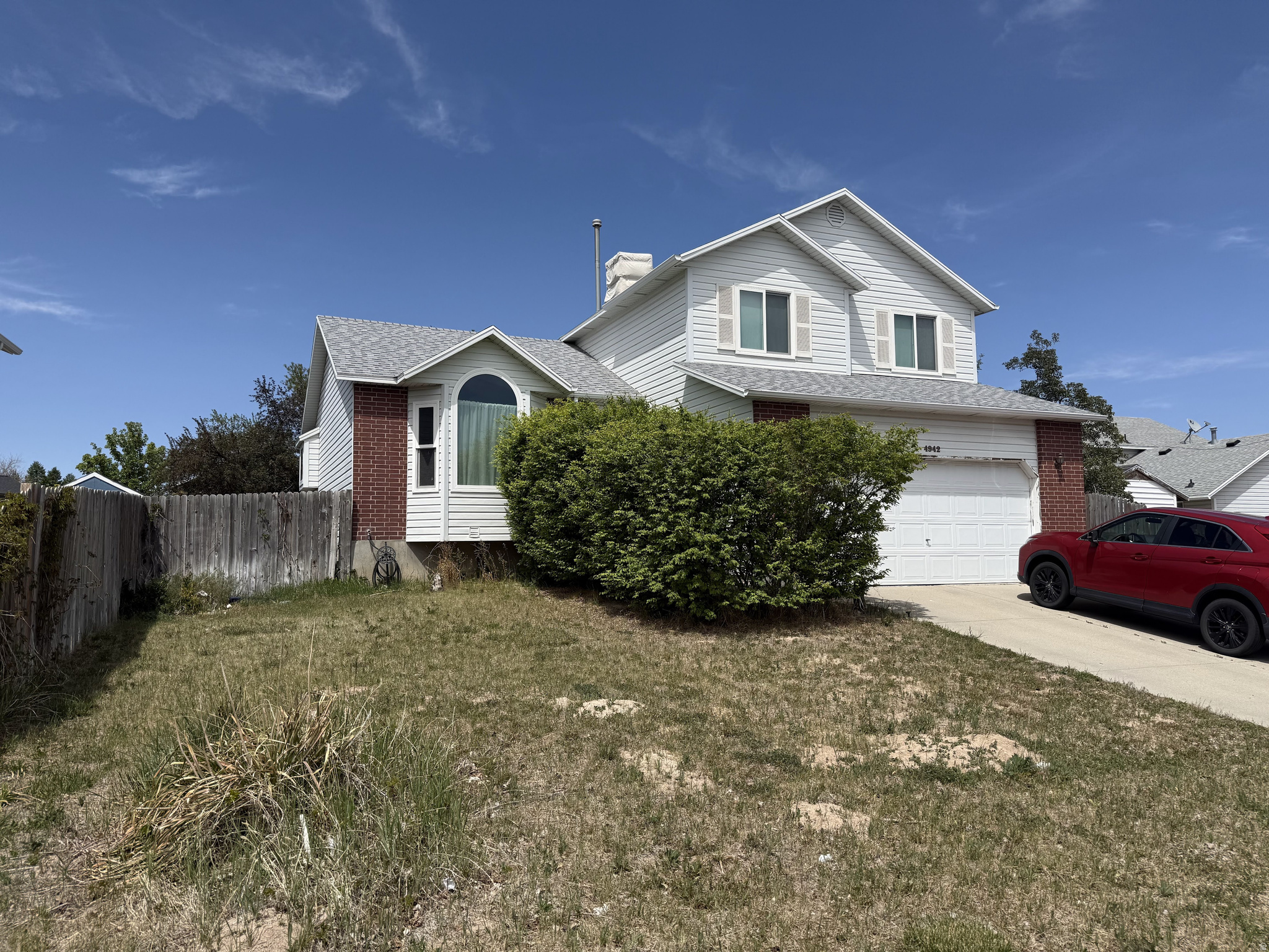 This tri-level near the Olympic Oval features 5 beds, 2 baths, and vaulted ceilings, creating a bright and open feel. You will love the new carpet and the big, spacious yard, which is a clean slate to be designed by you and your creativity. The home is complete with a full sprinkler system. The basement covers as much ground as the main floor, offering tons of extra living space. Square footage figures are provided as a courtesy estimate only and were obtained from a previous MLS listing and county records. The basement includes an extra portion not factored into county records. Buyer is advised to obtain an independent measurement.