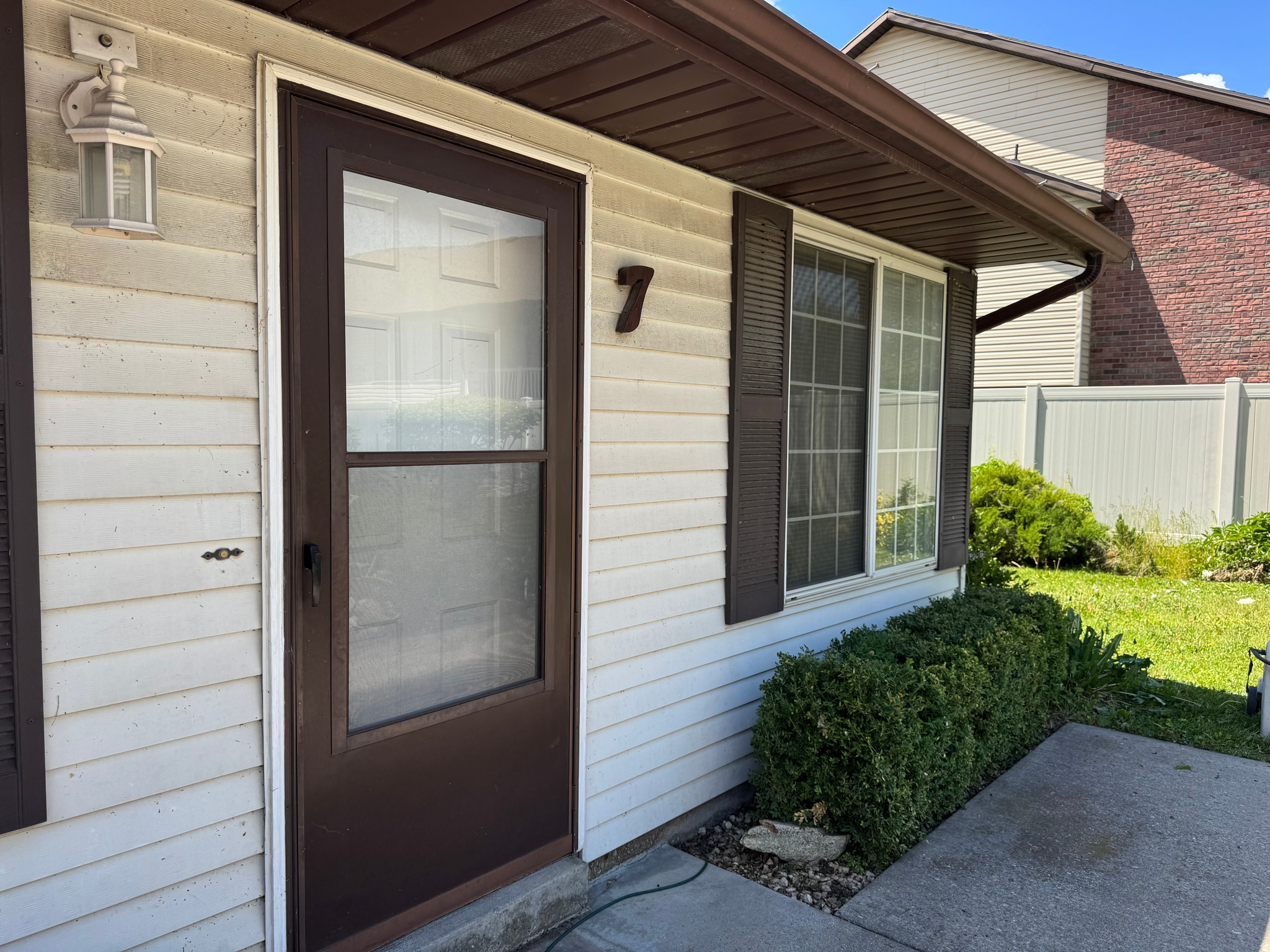 Welcome to 1709 N 200 W #7, a clean and well-maintained main-level condo offering comfort, convenience, and strong value under $250K. With 2 bedrooms, 1 bath, and 1,026 sq ft, this home provides an efficient layout with practical living space and easy access throughout. Newer carpet and paint give the interior a refreshed feel, while a water heater installed last year and an included water softener add meaningful everyday function.  The location within the community is a standout feature. Set on the far west end of the complex, the unit offers a more private setting with a grassy area behind it, creating a pleasant outdoor backdrop. Parking is another advantage, with one covered space plus an additional uncovered space for added flexibility. Whether you are looking for a primary residence or a low-maintenance property, this condo delivers useful updates, accessible main-level living, and a compelling price point. Schedule your showing today and see the value this home offers.