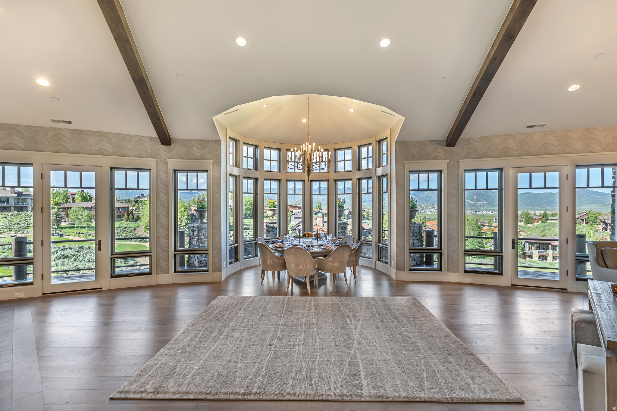 Pete Dye 4th hole frontage with unobstructed sight lines across Deer Valley and Park City Mountain. Full Golf Membership available separately through Promontory Club, a rare pairing in the current market.     Four bedrooms, five baths, 5,133 square feet on 0.90 acres in West View. The home has been fully remodeled inside and paired with a complete mechanical rebuild, so nothing has been deferred at move-in.     A barrel-vaulted stone entry opens to a main level with vaulted ceilings, walnut floors, and custom beam detail. The dining room anchors the home beneath a domed turret ceiling, with a radius window wall framing the view corridor from the golf course to the ski terrain. The kitchen features a professional range, marble island, and a full butler's pantry. Main-level primary suite with fireplace and curbless shower. The walk-out lower level adds a second living area, a kitchenette, a bunk room, and two guest suites. Private patio with hot tub and gas fireplace.     A dedicated ski prep room with boot heating, gear lockers, laundry, and shuttle access to Promontory, Deer Valley, and Park City Mountain.     Mechanical upgrades include new radiant zones, high-efficiency forced-air heating, whole-home water filtration, fire suppression, smart leak detection, LED lighting, and additional attic insulation.     Promontory Club amenities include two championship courses, clubhouse dining, fitness, tennis, pickleball, pool, and ski shuttle service.