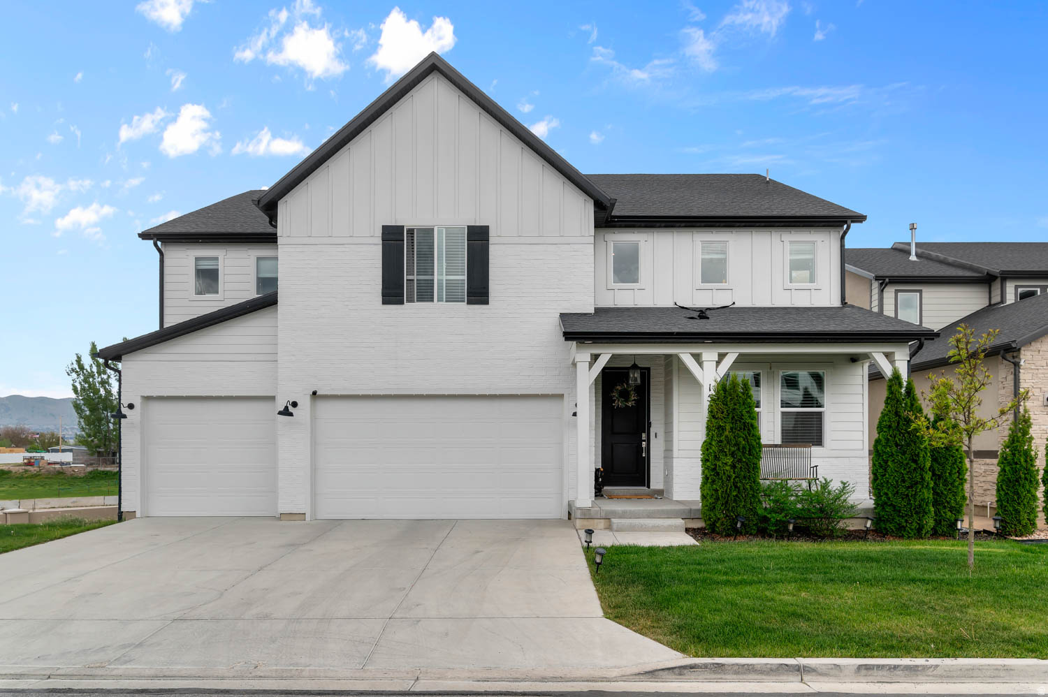 Beautifully designed 5-bedroom, 3-bathroom home with an open and functional layout. The main floor features soaring two-story windows that fill the home with natural light, a versatile flex room, a full bathroom, and a spacious main-level bedroom. The kitchen showcases craftsman-style white cabinetry, white quartz countertops, a contrasting taupe subway tile backsplash, stainless steel appliances, a range hood, and a convenient butler's pantry. Upstairs you'll find 3 additional bedrooms, a spacious owner's suite with a spa-inspired bathroom, and a dedicated laundry room. The unfinished basement offers plenty of room to grow and customize to fit your needs.