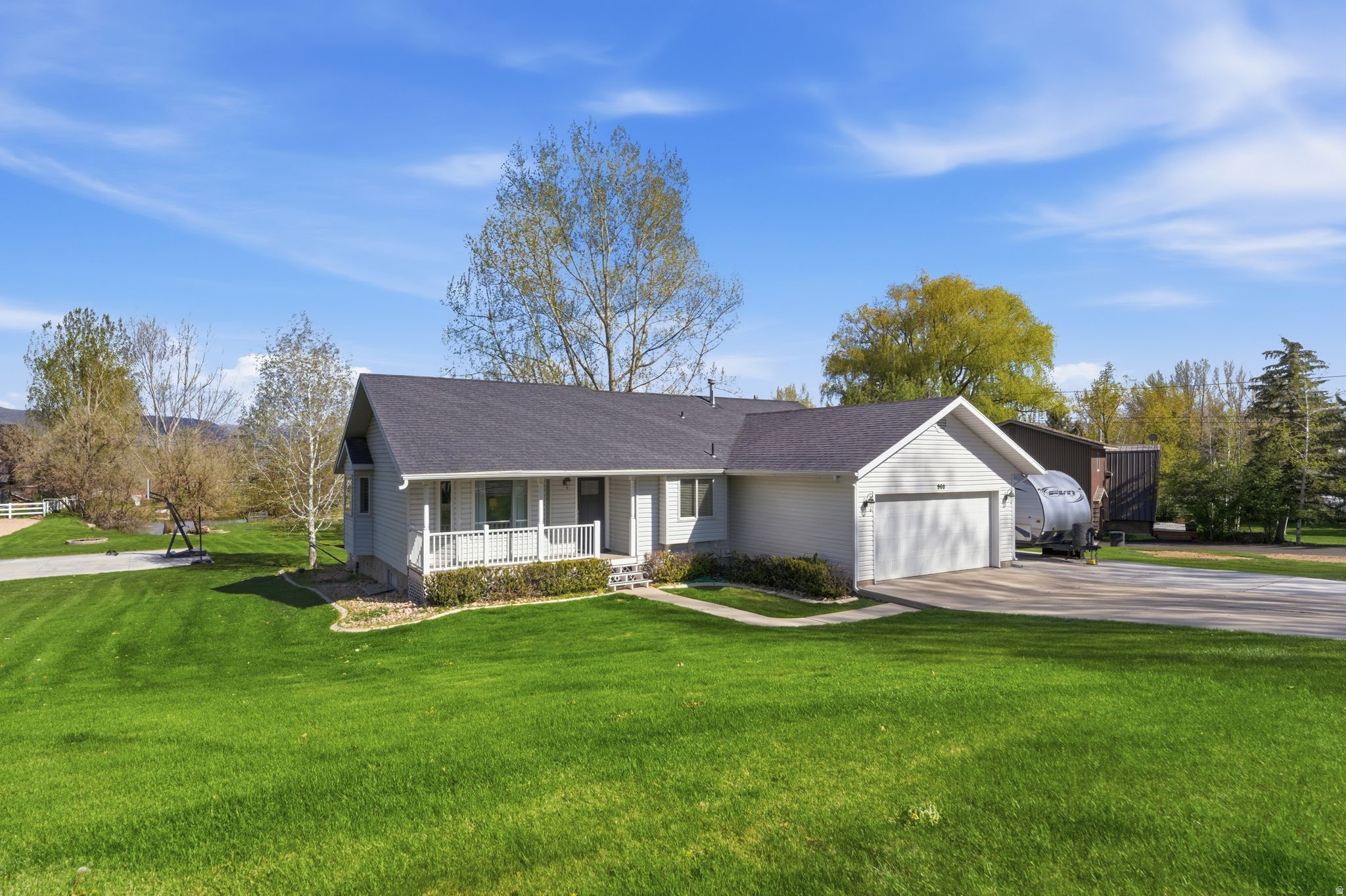 A Rare Find in Midway-Four Bedroom Home on a Fantastic Half Acre Lot With a Pond and No HOA! This unique Midway property is situated on a picturesque 1/2 acre lot in a quiet location just 1 mile to both Midway's Main Street and Wasatch Mountain State Park and is just 12 minutes to Deer Valley's East Village. This sublime location offers tranquility and convenience as it is close to everything but feels a world away from the hustle and bustle. The four-bedroom home has a main level primary bedroom with two secondary bedrooms and opens out to a large deck with hot tub and private, pastoral back yard with a pond, fire pit, and sports court. The lower level has another bedroom, bathroom, living room, and another room that could be used in many different ways. No HOA means improvements to the home and yard are limited only by your imagination. Midway has long been quietly known as the jewel of the Heber Valley, but that is not such a secret anymore. Midway's access to all manners of outdoor pursuits including it's five golf courses, blue ribbon fly fishing, recreating on the local reservoirs, nearby downhill ski resorts and Soldier Hollow, the 2002 and 2034 Olympic venue, as well as a plethora of trails for hiking, biking, horseback riding and 4X4ing has always been a draw for people who want to live surrounded by natural beauty and have access to outdoor recreation opportunities. To add to that mix, now Main Street is replete with great restaurants and trendy shopping that has made it a destination unto itself.  Bordered by the undevelopable state park land and national forest with impressive preservation of open space and forward thinking leaders, Midway has positioned itself to maintain it's small town character and attractiveness that will continue to elevate its value in the years to come as 5 Diamond level resorts open their doors just minutes away. If you are looking into your crystal ball for where to buy a home that will give you years of enjoyment and appreciation, this could be the one....