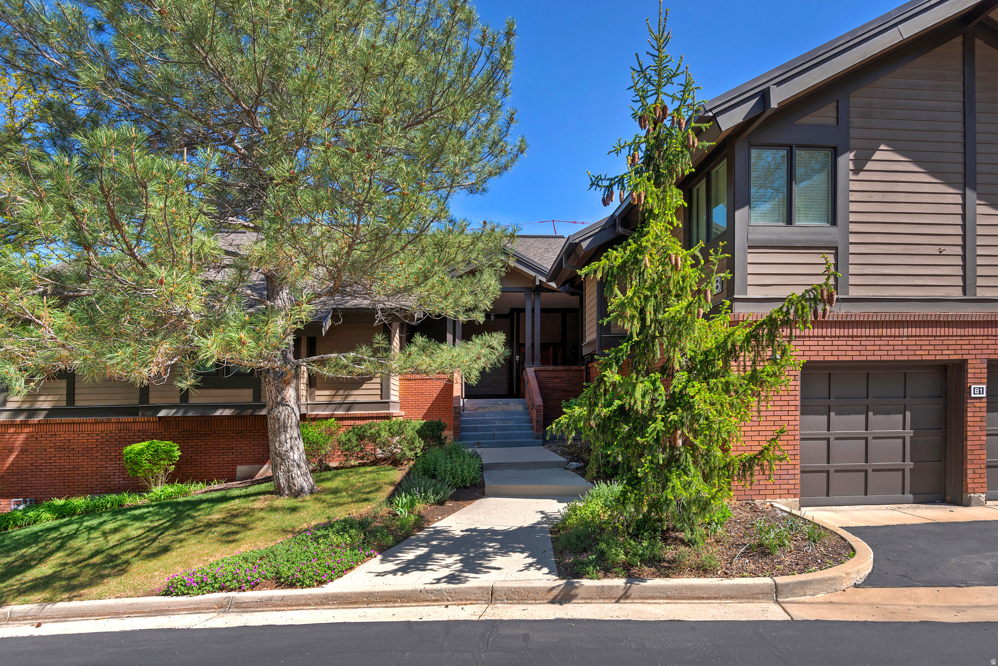 This exceptional townhouse, scarce in availability, sits within the coveted Canyon Racquet Club enclave. Ideally positioned for quick access to world-class ski resorts, the regional airport, and a vibrant dining scene, it rests alongside the scenic Big Cottonwood Canyon. Inside, the residence offers three bedrooms and two bathrooms, complemented by an expansive two-car garage that delivers abundant storage and parking. Whether viewed as a savvy investment, a vacation retreat, or a primary residence, this property stands out-further enhanced by a well-maintained HOA that permits short-term rentals, an extremely rare and highly desirable feature in this area. Opportunities with approved short-term rental flexibility in such a prime canyon location are few and far between. This is a must-see opportunity before it's no longer available.