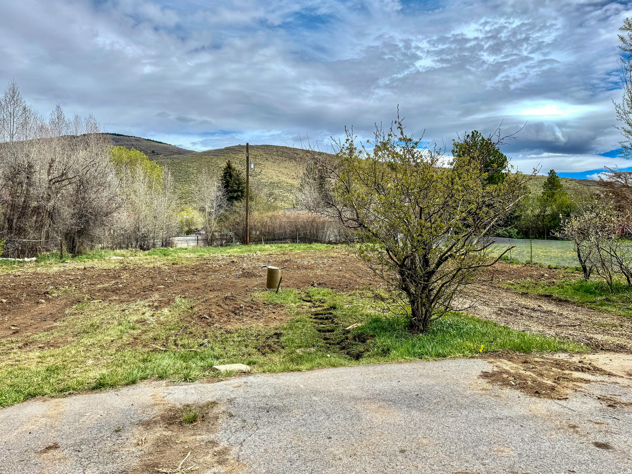 Rare Creekside Lot in Kamas !!  Build Your Dream Home  Discover the perfect blend of privacy and convenience with this exceptional 0.24-acre buildable lot, ideally situated at the end of a quiet dead-end road. With only three neighboring homes and no future development behind, this property offers a rare opportunity for peaceful, secluded living.  This ready-to-build lot features utilities already stubbed, saving time and expense as you plan your custom home. A tranquil creek runs along the rear of the property, creating a serene natural backdrop and inviting outdoor atmosphere. The lot also offers flexible design potential, including the possibility for dual access from both the front and rear.  Enjoy immediate access to nearby canal and trail systems, perfect for hiking, biking, and exploring the outdoors. There is also potential for inclusion of a water share, adding additional value and usability.  Conveniently located within walking distance to local amenities including South Summit schools, the South Summit Fitness & Aquatic Center, Kamas Valley Library, and nearby grocery, pharmacy, and health services.  Easy commute to Park City (approximately 20 minutes) and Salt Lake City (approximately 45 minutes), making this an ideal location for a primary residence, second home, or investment property.  Don't miss this rare opportunity to own one of the last secluded creekside lots in the Kamas Valley.