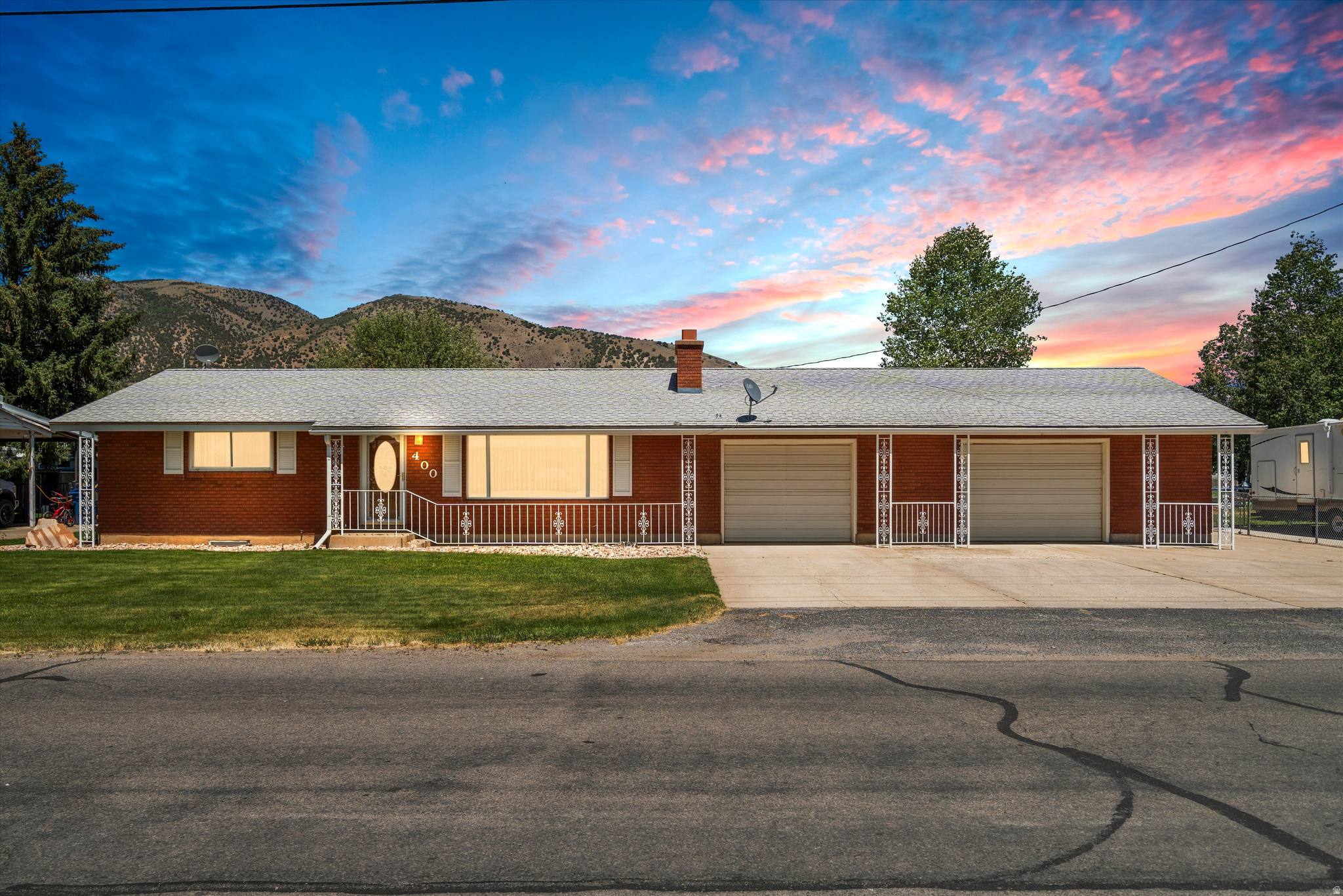 Enjoy wide-open space and stunning mountain views from this well-maintained Morgan home situated on a spacious .52-acre lot. This property offers the perfect blend of comfort, functionality, and room to grow. Inside you'll find 3 bedrooms and 2 bathrooms with a comfortable layout designed for everyday living. Natural light fills the home, and the surrounding views create a peaceful, country-living feel while still being conveniently located. Step outside to a fully landscaped yard with mature lawn and outdoor space ready for entertaining, gardening, or simply enjoying the quiet. The standout feature is the large detached shop with power - ideal for hobbies, storage, business use, or additional workspace. Whether you're looking for space to spread out, room for toys, or a property with true utility, this Morgan home delivers. Buyer verify all information.