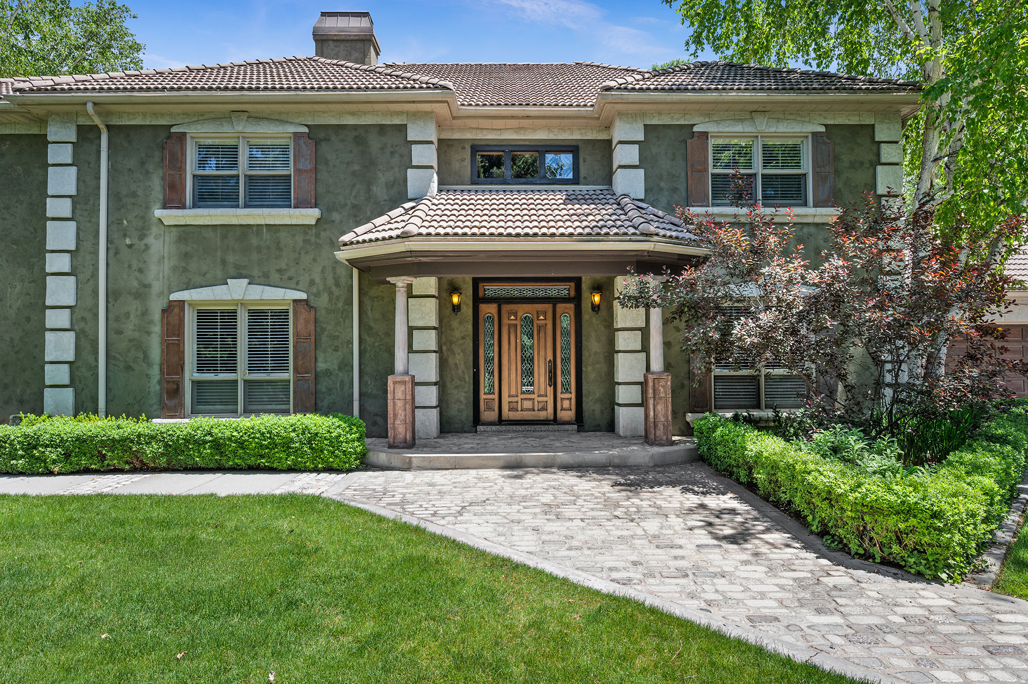 Experience the renewed appeal of this magnificent gated Holladay estate. Recent updates include fresh white paint in the main family room and kitchen,  giving the home's central gathering spaces a bright, crisp, and contemporary feel. Select staging enhancements have been added to further elevate the presentation and showcase the property's exceptional lifestyle. Nestled on a private one-acre setting with mature landscaping, pool, waterfall, and elegant living spaces throughout, this is a rare opportunity to own one of Holladay's signature residences.  "The Holladay House" - a rare European-style estate is a gated, secluded 1-acre property in the heart of Holladay. Offering over 5,600 square feet of all-above-grade living space, this home combines timeless design, privacy, and opportunity in one of Utah's most desirable neighborhoods. The two-story layout flows beautifully, featuring an open kitchen with granite countertops, gas range, double wall ovens, walk-in pantry, and built-in appliances. The large primary suite offers a separate fireplace sitting area, vaulted ceilings, jetted tub, and walk-in closet. Thoughtful details include plantation shutters, built-in speakers, wet bar, French doors, and abundant natural light throughout. Step outside to a resort-style backyard with a pool, waterfall and pond, fruit trees, gardens, and mature landscaping. A garden/potting cottage in the elevated back yard is perfect for the gardening professional, and 3-car garage with lots of storage, completes the amazing setting. Located just minutes from Holladay Village, ski canyons, top-rated schools, dining, and shopping, this property offers unmatched location, livability, and future potential. A truly rare Holladay opportunity. Square footage figures are provided as a courtesy estimate only. Buyer is advised to obtain an independent measurement.    There are 2 Living Rooms on main floor, 2 Family Rooms/Den, Full Office and a Theater Area.