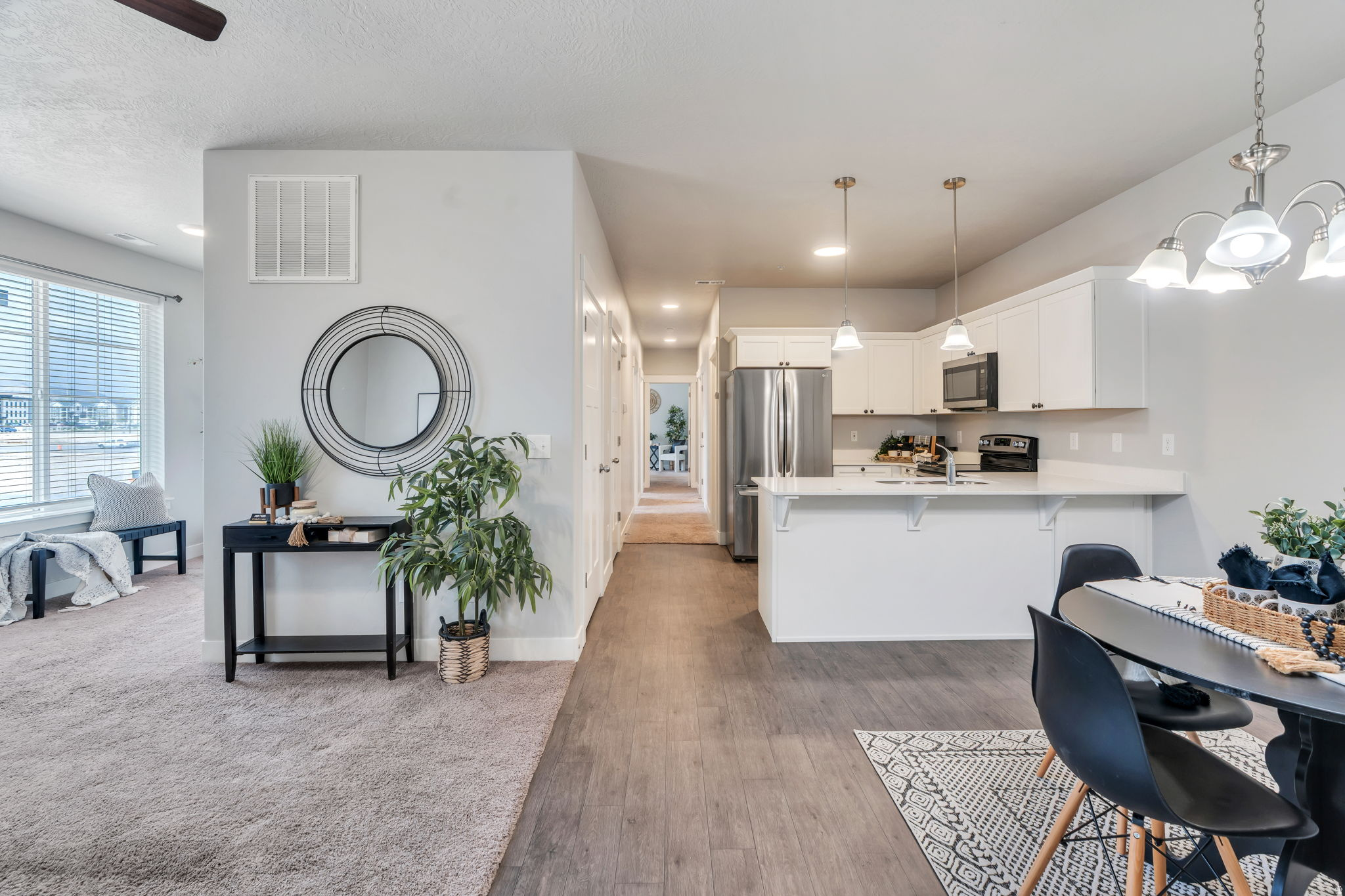 This beautiful 3-bedroom, 2-bathroom condo is in the highly desirable Timp Point community in Lehi, built in 2022 and thoughtfully maintained. Ideally located directly across fromPrimary Children's Hospitaland with a new grocery store coming in just to the west, this area continues to grow and thrive.The home features a bright, functional layout with two versatile alcoves-perfect for a home office, reading nook, play space, or additional flex areas to fit your lifestyle.  Enjoy easy access to Redwood Road and I-15, making commuting and daily errands simple and convenient.All appliances are included, including a newer refrigerator, washer, and dryer-making this home truly move-in ready. Community amenities include a clubhouse, pool, and pickleball courts, offering both comfort and connection in a vibrant neighborhood.