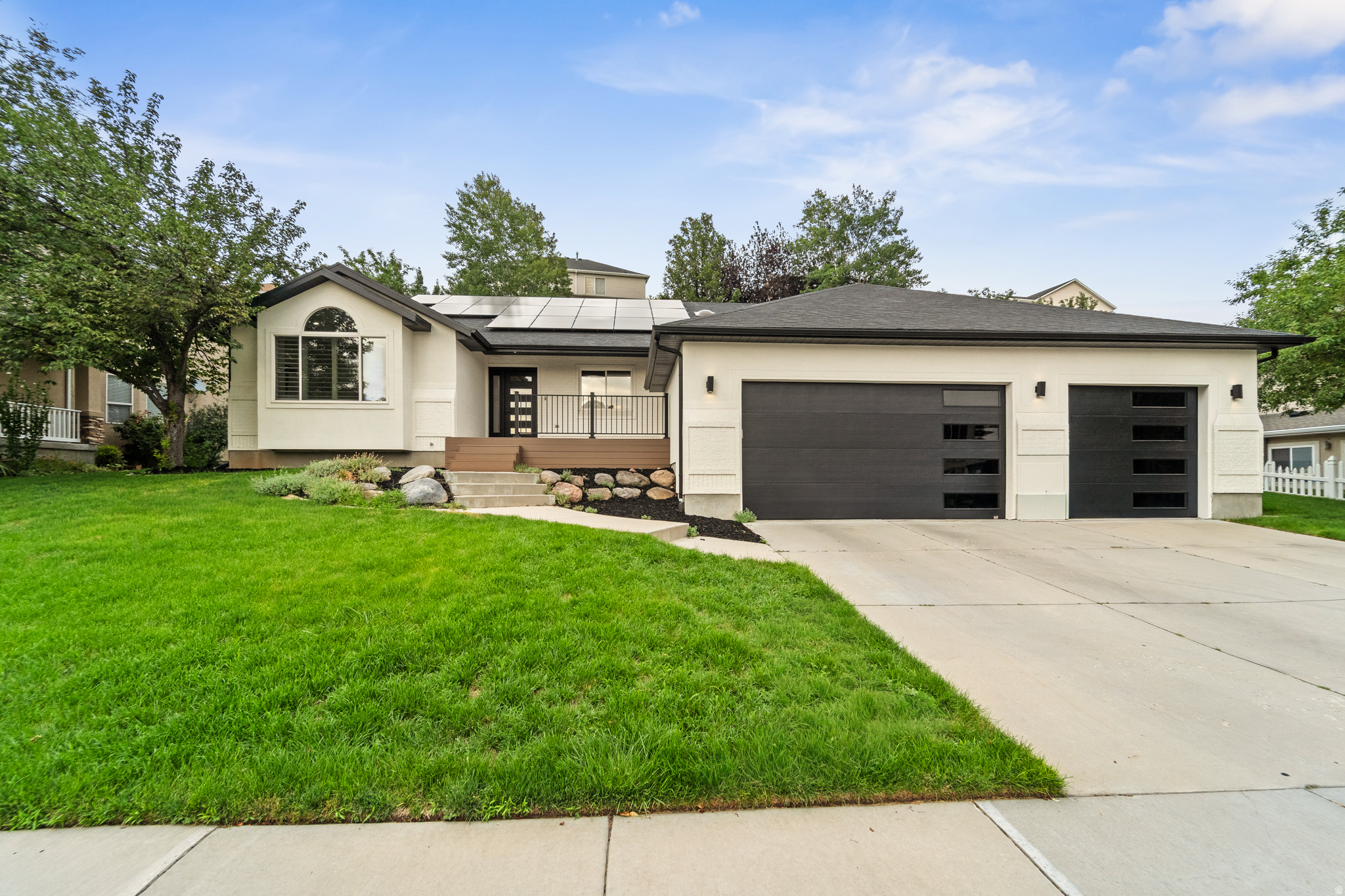 Beautifully renovated 6-bedroom, 4.5-bath home featuring an open and functional floor plan designed for comfortable living and effortless entertaining. The main level offers 3 bedrooms, 2.5 bathrooms, a den, laundry room, spacious living and dining areas, and a stunning chef's kitchen with quartz countertops, an oversized island, farmhouse sink, gas range, and seamless flow into the inviting family room with fireplace. The fully finished basement provides exceptional flexibility with 3 additional bedrooms, 2 full bathrooms-including a Jack-and-Jill bath-a second laundry room, full kitchen, dining area, spacious recreation room, sitting area, and ample storage, making it ideal for multigenerational living, guests, or rental potential. Enjoy the beautifully landscaped backyard, owned solar panels, and an oversized 3-car garage. Conveniently located just minutes from world-class ski resorts, mountain recreation, shopping, dining, and freeway access, this move-in ready home offers the perfect blend of modern updates, functionality, and an unbeatable location.