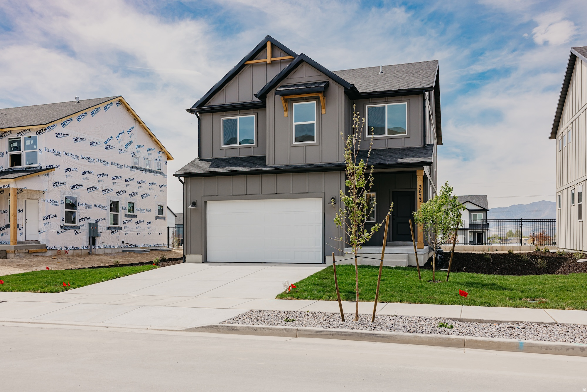The Bridger Farmhouse combines comfort, style, and practicality across 2,434 square feet of thoughtfully designed living space, including over $59,000 in upgrades throughout the home. This two-story layout offers 4 bedrooms and 3.5 bathrooms, with an open-concept main level that seamlessly connects the family room, dining area, and kitchen. The kitchen is enhanced with quartz countertops, upgraded cabinetry, a spacious 6-by-3-foot island, and Whirlpool stainless steel appliances. An upgraded sliding glass door leads to a low-maintenance composite deck, perfect for relaxing or entertaining outdoors.  Upstairs, the private owner's suite features dual vanities, a walk-in shower, and a large walk-in closet. Three additional bedrooms and a conveniently located laundry room complete the upper level. The finished basement adds even more versatility with a recreation room, an additional bedroom and bathroom, plus extra storage space-ideal for guests, a home office, or flexible living arrangements.