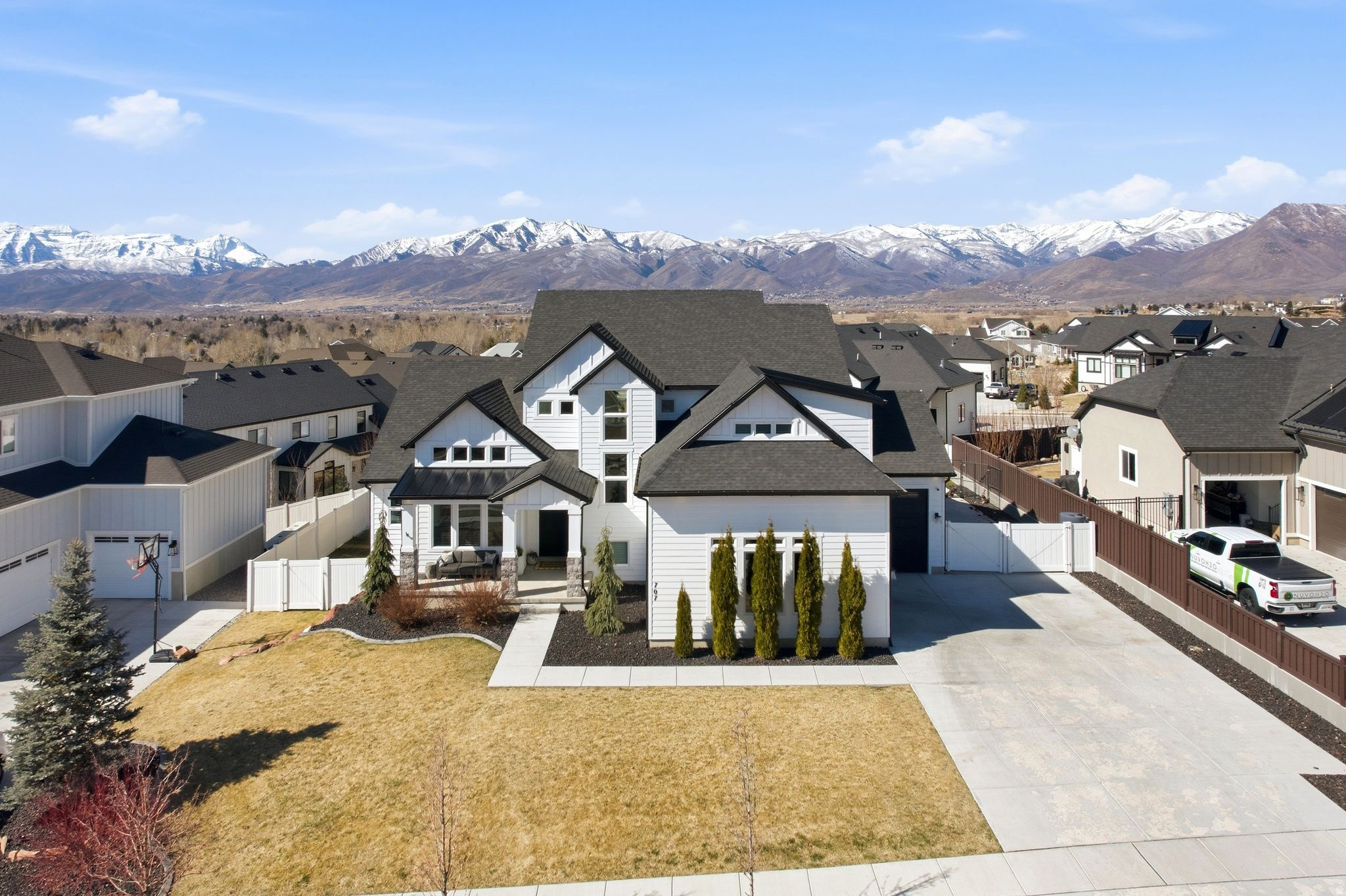 Enjoy elevated living in this gorgeous, turn-key home on Heber Valley's East bench in the Stone Creek Residences! Experience open concept living at its finest, with vaulted ceilings, an abundance of natural light, oversized living spaces, extra tall door heights, and the perfect floor plan to maximize functionality and comfort. Timeless finishes make this home standout with hand-scraped wood floors throughout the main level, a beautiful stone fireplace in the heart of the home, tasteful neutral elements and custom upgrades throughout. The spacious main floor master suite offers two separate vanities, a soaker tub, toilet room and walk-in closet. Surround yourself with the comforts of home in the gourmet kitchen complete with an oversized island, pantry, gas range, custom hood, double oven and plenty of cabinet space. The vaulted office offers an inviting space for productivity and creativity. Take in the fresh mountain air on the covered front porch and back covered patio, that's ideal for outdoor cooking and relaxation. The newly finished basement is bright, open, and perfect for entertaining with its second full kitchen, open family/game room, glamorous jack and Jill bathroom, two large bedrooms and plenty of extra storage space. The permanent exterior lighting is awesome for holidays, seasonal and daily lighting customizations. This wonderful home boasts one of the largest lots in the neighborhood, complete with a fully fenced yard, RV parking and mountain views. Vivint security system and cameras included. *Sellers will consider low-interest Seller Financing with considerable down payment!* Conveniently located within a few minutes of a variety of outdoor activities and Main Street. 15 minutes to Park City, 45 minutes to SLC Airport, 25 minutes to Orem. Information provided as a courtesy. Buyer to verify.
