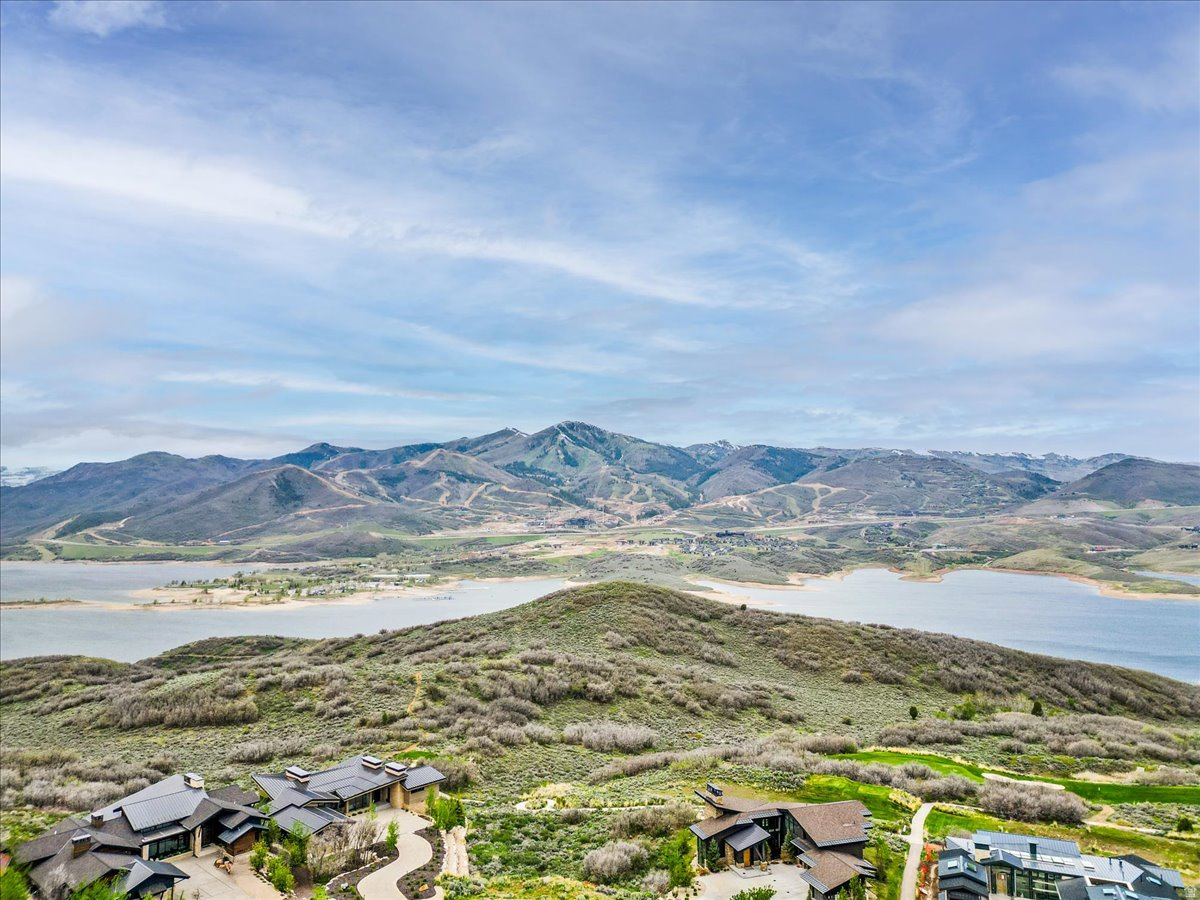 Premier 0.52-acre homesite in Hideout showcasing sweeping views of Jordanelle Reservoir, Deer Valley's new East Village, and Mount Timpanogos, ideally positioned along the 2nd hole of the Outlaw Golf Course. Direct access to nearby walking and biking trails and just minutes to world-class skiing and year-round recreation. Build your custom home to capture panoramic ski slopes and mountain views. Only 10 minutes to Park City's renowned dining, shopping, and historic Old Town. Hideout HOA includes common area landscape maintenance, trail upkeep, utilities, reserve fund, and more. All information is deemed reliable but not guaranteed. Buyer to verify.
