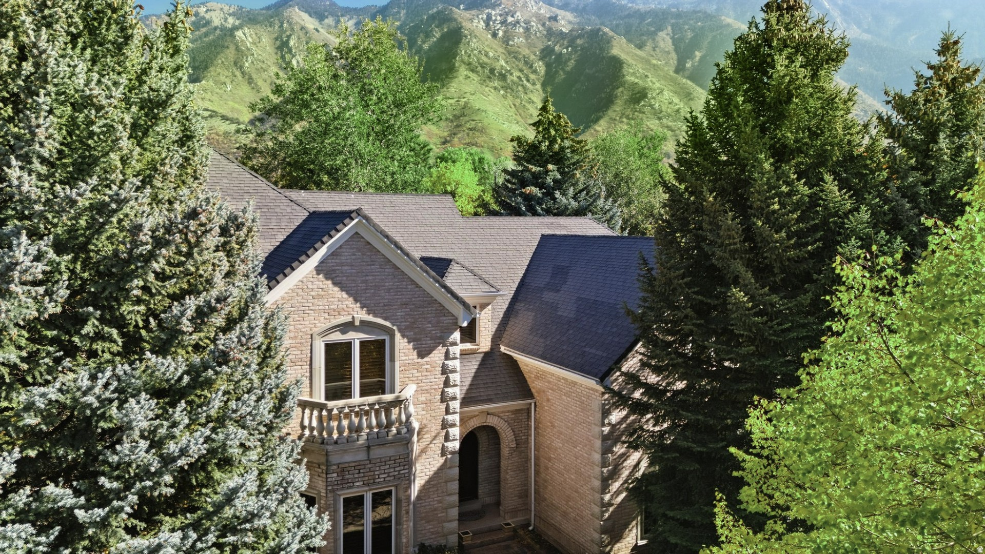 *Rarely Available is this Backyard East Facing Spectacular Mountain View Property, One Owner all Brick Custom 2 story. Discover an unparalleled lifestyle in the coveted 24 hr guard gated 477 acre Pepperwood community, boasting an array of amenities including the pool, spa, large splash pad, lifeguards, competition swim team, sand volleyball, tennis, basketball and pickleball courts, playground/park, walking/biking trails, and Year-round Events that include 4th of July parade, Easter egg hunt, High school graduation party and food truck nights. The Pepperwood Community sets the stage for an active and vibrant lifestyle, fostering a strong sense of community. Just outside the Pepperwood Community you are conveniently located within minutes of more hiking and biking trails, world-class ski resorts, recreational activities, lakes, shopping, and the international airport. Step inside to an open-concept layout that balances expansive gathering spaces with intimate private retreats. Soaring ceilings, rich custom millwork, and walls of windows bathe each room in natural light . The kitchen, dining and great room areas are perfect for hosting both casual family evenings and formal gatherings. The home's thoughtful design continues with an extra large primary bed/bath suite that functions as a true sanctuary, offering a generous walk-in closet. Each additional bedroom and guest suite is designed with comfort and privacy in mind. The oversized main floor office can be a large bedroom with large walk-in closet and double doors accessing to the private back yard. The Daylight lower level provides endless opportunities for entertainment backyardation-with a second oversized Primary Bed/Bath suite, theater room, fitness area, and spacious recreation zone. Retreat to your wooded, east facing, private back yard and with the removal of a few trees you will find spectacular unobstructed mountain views .Buyer to verify All information and sq footage. For appts call Co-Agent/Shelly Tripp and she has key to let you in and must be at all showings.