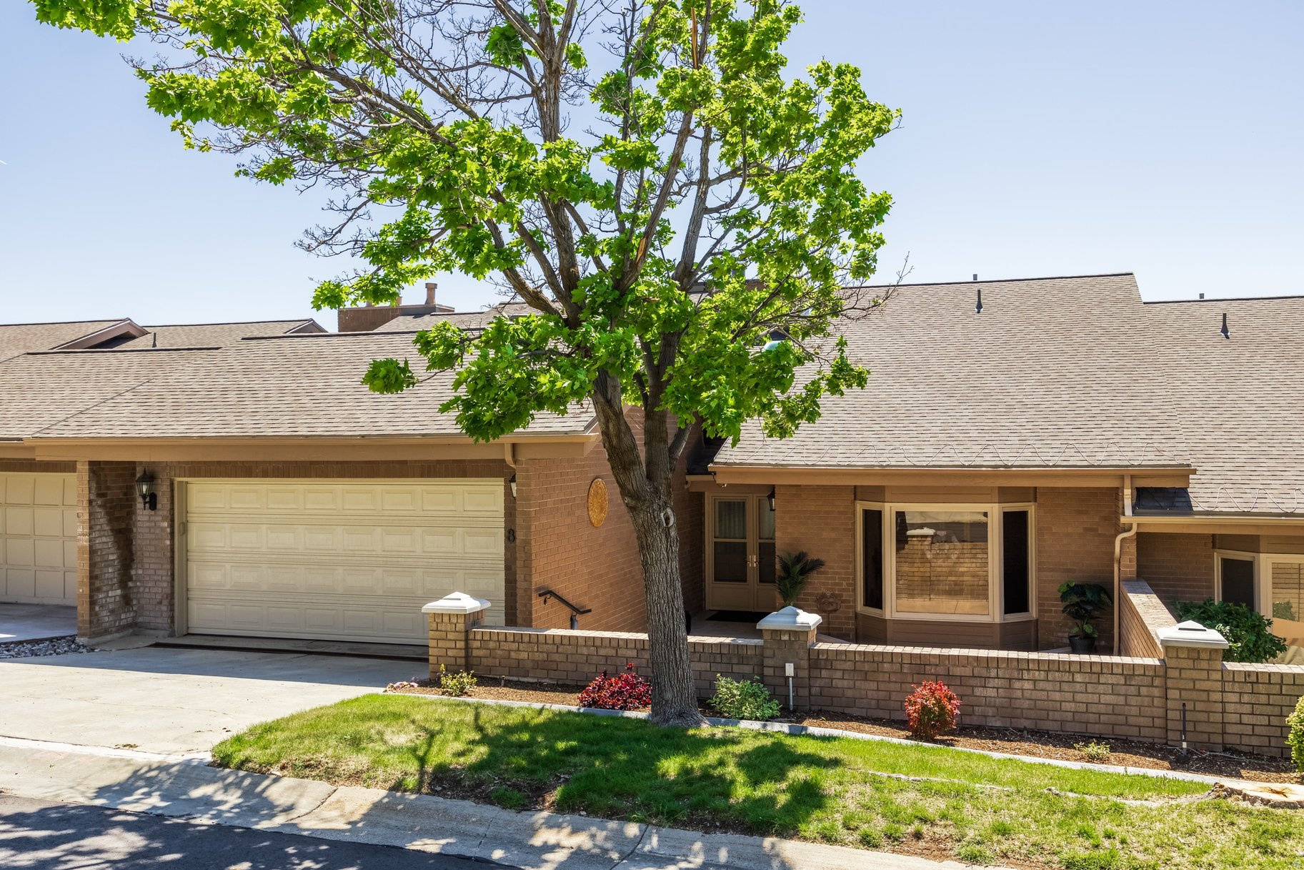 Mind blowing views in this gorgeous beautiful home located in Northpoint Estates gated community. The main-level living area features an open floor plan filled with natural light and stunning views of the Capitol, Great Salt Lake, and Oquirrh Mountains.  The updated kitchen showcases modern finishes, generous counter space, and a layout perfectly suited for both everyday living and entertaining. The fully finished walk-out basement adds exceptional versatility with a second kitchen and spacious den, ideal for guests, entertaining, or multi-generational living. Step outside to the private lower-level courtyard, a true oasis for peaceful mornings and quiet relaxation. It lives like your own private backyard but is maintained by the HOA. Enjoy spectacular sunsets from the deck with breathtaking panoramic views of downtown Salt Lake City, the Great Salt Lake, and the surrounding mountains. The home also features the luxury of a cedar closet, offering both charm and practical storage.  This exceptional location provides the perfect balance of tranquility and convenience, with easy access to downtown Salt Lake City, Salt Lake International Airport, and the University of Utah. HOA-maintained exterior building care allows for low-maintenance living, while community amenities include a pool, tennis courts, and clubhouse.