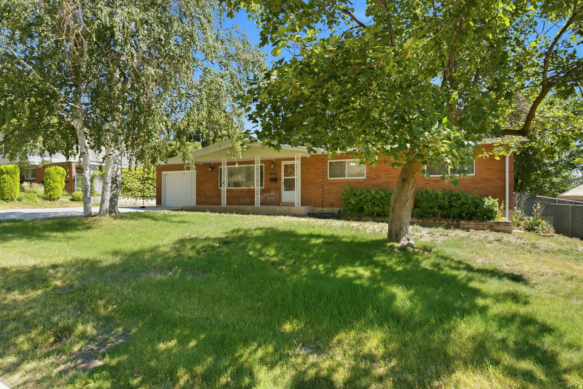 Don't miss out on this 4 bedroom 2.5 bathroom Brigham City home! Inside, the primary suite features a stunning updated master bathroom. Enjoy peace of mind with fully updated electrical throughout, including a new electrical panel, and a new AC system installed last year for year-round comfort and efficiency. Gather around the cozy fireplace or entertain guests on the spacious covered patio overlooking a yard filled with beautiful mature trees that provide shade and exceptional curb appeal. Car enthusiasts, hobbyists, and those needing extra storage will appreciate the two garages-one attached to the home and a second detached garage complete with a built-in heated shed/workshop. Conveniently located with easy freeway access and just minutes from shopping, dining, schools, parks, and everything Brigham City has to offer.