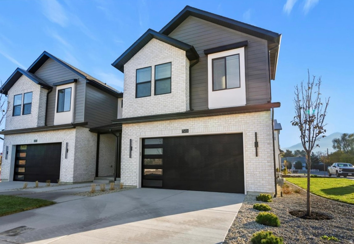 New construction in Trailside Reserve! This stylish twin home lives like a single-family home with a fireplace insert, quartz countertops, under-cabinet lighting, included blinds, and an open great room. EV charging port installed, fully fenced backyard, full unfinished basement, and low-maintenance HOA living. Virtually staged; photos may vary by unit. The photographs depict a different model with the same finishes and are provided for illustrative purposes only.