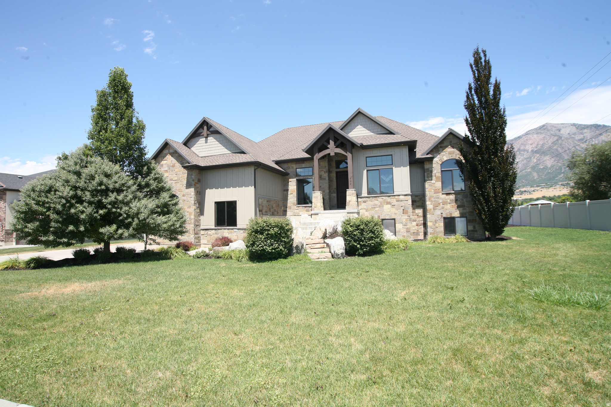 Luxury Model home !  This home has all the upgrades and features that you would hope for in a home. To replace this home you would pay over $1,300,000 take advantage of living in a model home and be the first home owner.  This list of upgrade is available upon request. However you will love the designers touch in every space.  Huge Vaulted Ceilings, 9 foot basement ceilings and grand exteriors that are timeless. The home has a grand master suite with bathroom that includes a spa shower, oversized soaking tub and all the features to relax. This kitchen includes professional Range and all the storage you could want, the Walk in butler pantry includes sink and cabinets. This home has a just the right spaces for many lifestyles.  The home is fully finished from garages that are fully painted, and have epoxy flooring. You will love the detached garage that is also fully finished will space above the garage that could be used for so many things. For those that love luxury at great value you may want to visit luxury.  Take advantage of finding out more details about this home that is being offered for the first time.  Call for personal showing. If you love Pleasant View and North Ogden Inquire about our other New Construction homes.