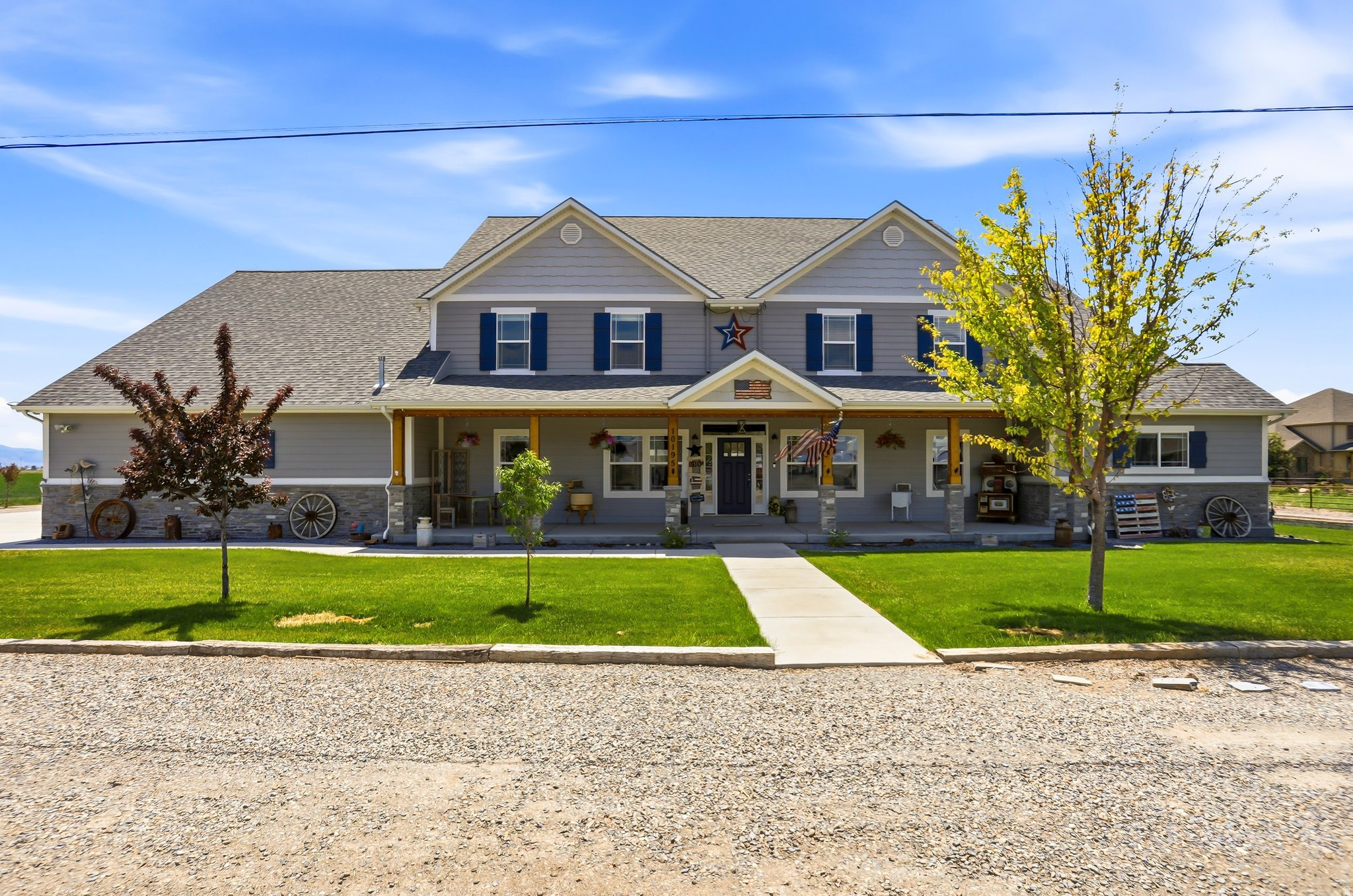 Welcome to a truly one-of-a-kind luxury lifestyle property in Bothwell, where custom craftsmanship, comfort, recreation, efficiency, and functionality come together on 5 usable acres. Thoughtfully designed and expanded from the original farmhouse, this exceptional custom home was completed in 2020 and offers over 7,000 sq ft of highly functional living space with 5 bedrooms, 3.5 bathrooms, multiple gathering areas, and extensive upgraded systems throughout. The main level features an open-concept floor plan with 9-foot ceilings, a spacious great room, custom antiqued cabinetry, large pantry, farmhouse sink, gas range, office, oversized laundry room, and a luxurious primary suite with walk-in/through closet, jetted tub, and separate walk-in shower. Upstairs features vaulted ceilings reaching approximately 17 feet, a large secondary living space with kitchenette, oversized bedrooms with loft areas, game room, and additional laundry/storage space. The attached garage area has been thoughtfully designed to include a dedicated climate controlled home gym space with professional flooring and included equipment or could be used as a third car garage. Heated oversized garage. Designed for both comfort and efficiency, the property includes multiple high-efficiency HVAC systems, spray foam and upgraded insulation packages, insulated garage doors, smart thermostats, Wi-Fi booster system, two Napoleon gas fireplaces with blowers, on-demand hot water, owned solar system with 36 panels, whole-home Generac backup generator, upgraded 20-year smoke and carbon monoxide detection systems, six exterior security cameras, and JellyFish permanent exterior lighting. Outside, the property continues to impress with extensive utility and recreation amenities including oversized RV parking with 50-amp hookup, multiple outbuildings, climate-controlled insulated workshop with office and 220 power, additional storage buildings, covered equipment storage, fenced backyard, Bullfrog hot tub, mature trees, fruit trees, and approximately 3 acres of irrigated farm ground with 3 water shares included. A private irrigation surface well services the sprinkler system and tree drip lines, supporting the property's agricultural and landscaping capabilities. This is a rare opportunity to own a fully integrated lifestyle property offering luxury living, recreation, workspace, self-sufficiency, efficiency, and long-term functionality all in one exceptional package. Buyer to verify all information.