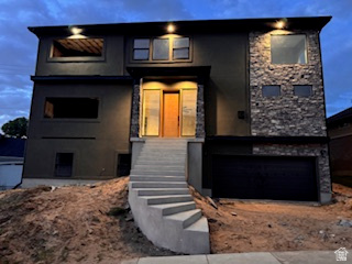 Modern luxury is taking shape in South Ogden! This under-construction custom 2-story home offers a bright, open design with elevated ceilings on every level and incredible indoor/outdoor living.  The main level features 10' ceilings, a stunning great room with fireplace, and a modern layout filled with natural light. Upstairs, the oversized MASTER SUITE is A TRUE RETREAT with dramatic 8' - 15' ceiling, its own fireplace, and access to elevated outdoor living. Two patios with fireplaces create cozy spaces to unwind, entertain, and enjoy the mountain lifestyle.  The basement offers 9' ceilings and a built-in ADU with a separate heating and cooling system, adding flexibility for guests, extended family, or investment potential.  Located in South Ogden with easy access to the great outdoors, this home is less than 30 minutes from Snowbasin Ski Resort and Wasatch Peaks Ranch (skiing & golfing). Within 3 minutes of the Ogden Golf & Country Club!    Modern comfort, lifestyle, and ADU attached.   Square footage figures are provided as a courtesy estimate only and were obtained from builder plans.    Buyer is advised to obtain an independent measurement.