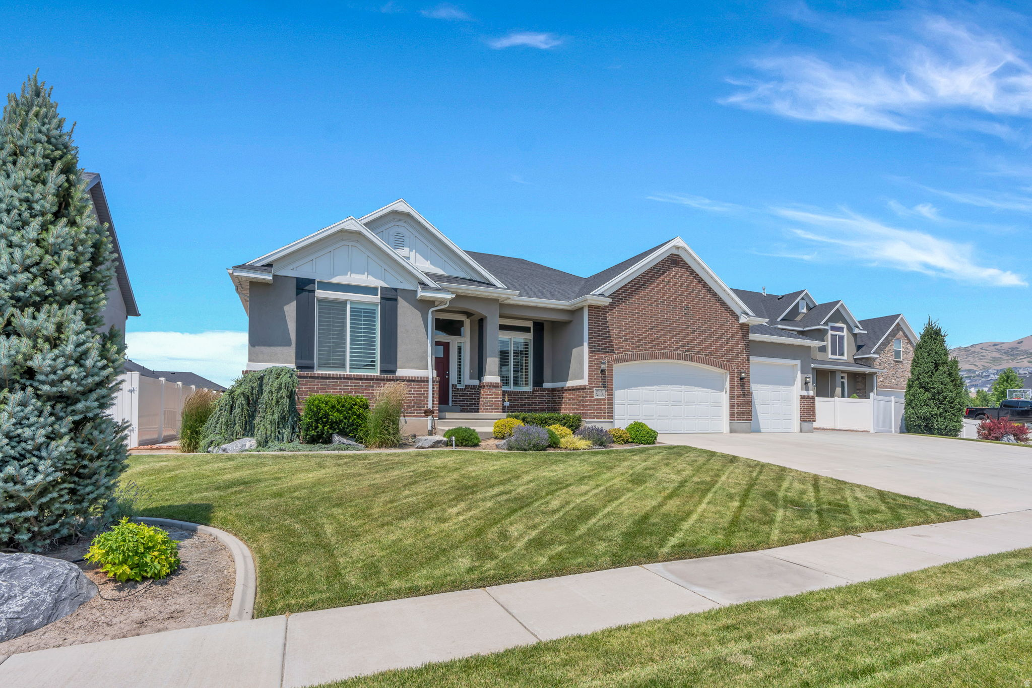 Welcome home to this beautifully maintained rambler in the highly sought-after Eagle Ridge community of East Lehi! Situated on a spacious 0.257-acre lot, this one-owner home has been meticulously cared for and offers the perfect combination of comfort, quality, and true main-level living. Designed with both everyday living and entertaining in mind, the open floor plan features a spacious great room with vaulted ceilings and a cozy fireplace, flowing seamlessly into the kitchen and dining area. The main-level primary suite provides a private retreat with a walk-in closet, jetted tub, and separate shower, while two additional bedrooms, a formal living room, and a convenient laundry room complete the main floor. The full 2,175 sq. ft. basement with a separate entrance provides incredible potential to create additional living space, a guest suite, home theater, gym, or future accessory apartment. Step outside to a private, beautifully landscaped backyard that feels like an extension of the home-perfect for relaxing evenings, family gatherings, or entertaining under the pavilion. The oversized extra-deep, extra-long 3-car garage, expansive driveway, and dedicated RV parking provide exceptional space for vehicles, trailers, and all your recreational toys. Additional features include granite countertops, smart thermostat, fiber internet, central air,  mountain views, and best of all-NO HOA! Ideally located in the heart of North Utah County near Silicon Slopes, you'll enjoy quick access to Thanksgiving Point, Traverse Mountain Outlets, I-15, American Fork Canyon, hiking, biking, and endless year-round recreation. Located within the highly acclaimed Alpine School District, including Eaglecrest Elementary, Viewpoint Middle School, and walking distance to Skyridge High School. This exceptional home truly reflects pride of ownership and offers the rare combination of space, location, and flexibility that today's buyers are looking for. Don't miss your opportunity to make it yours!  Square footage figures are provided as a courtesy estimate only and were obtained from county records .  Buyer is advised to obtain an independent measurement.