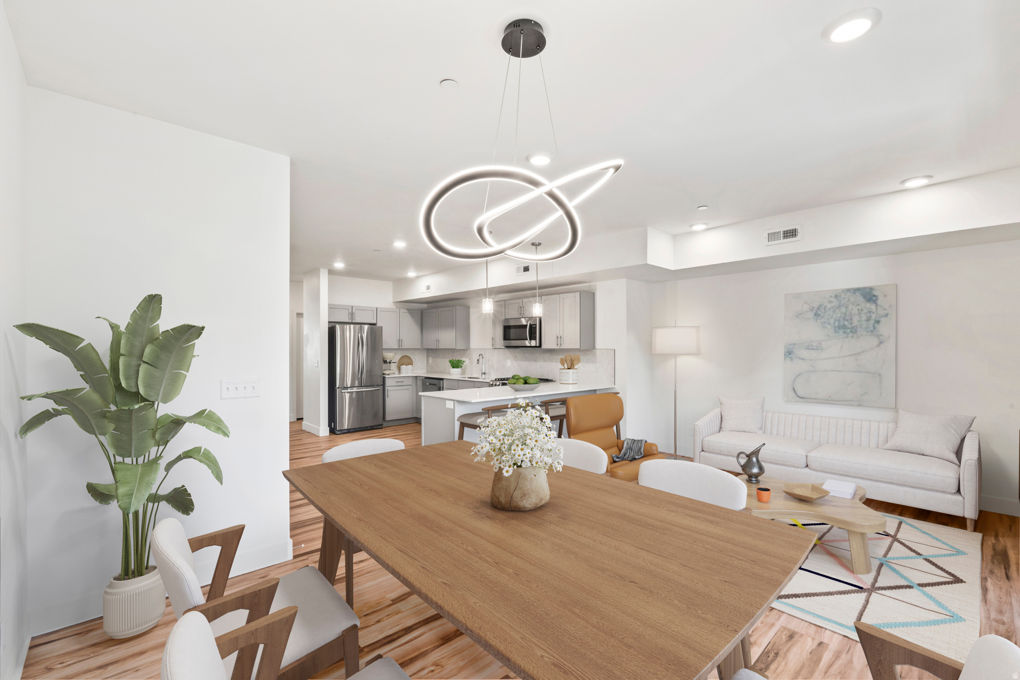 Enjoy stylish, low maintenance living close to the heart of downtown, just a few blocks from the SLCC campus! This sophisticated two story condo is full of light and open spaces, with tall ceilings that make it feel like you can really breathe! It has been lovingly maintained by a single owner since it was new in 2019; enjoy peace of mind with a new AC and water heater. Quartz counters elevate the feel of the spacious kitchen, with stainless steel appliances, and extra storage in the pantry. Expansive, double paned windows ensure your home is quiet, and the sunshine that streams in will have your houseplants LOVING life! Not to mention you're close to some of the BEST brunch spots - it's just a short walk to Sweet Lake Biscuits & Limeade, Penny Ann's, or The Honeysuckle Coffee Co. Or pop on over to Big Willie's in the evening to shoot some pool, or Piper Down to enjoy the live music! There are no compromises here - all the perks of city living, while having the spacious square footage and light filled rooms to be comfortable and entertain at home! HOA perks: High speed internet is included, AND pets are allowed, without weight restrictions!