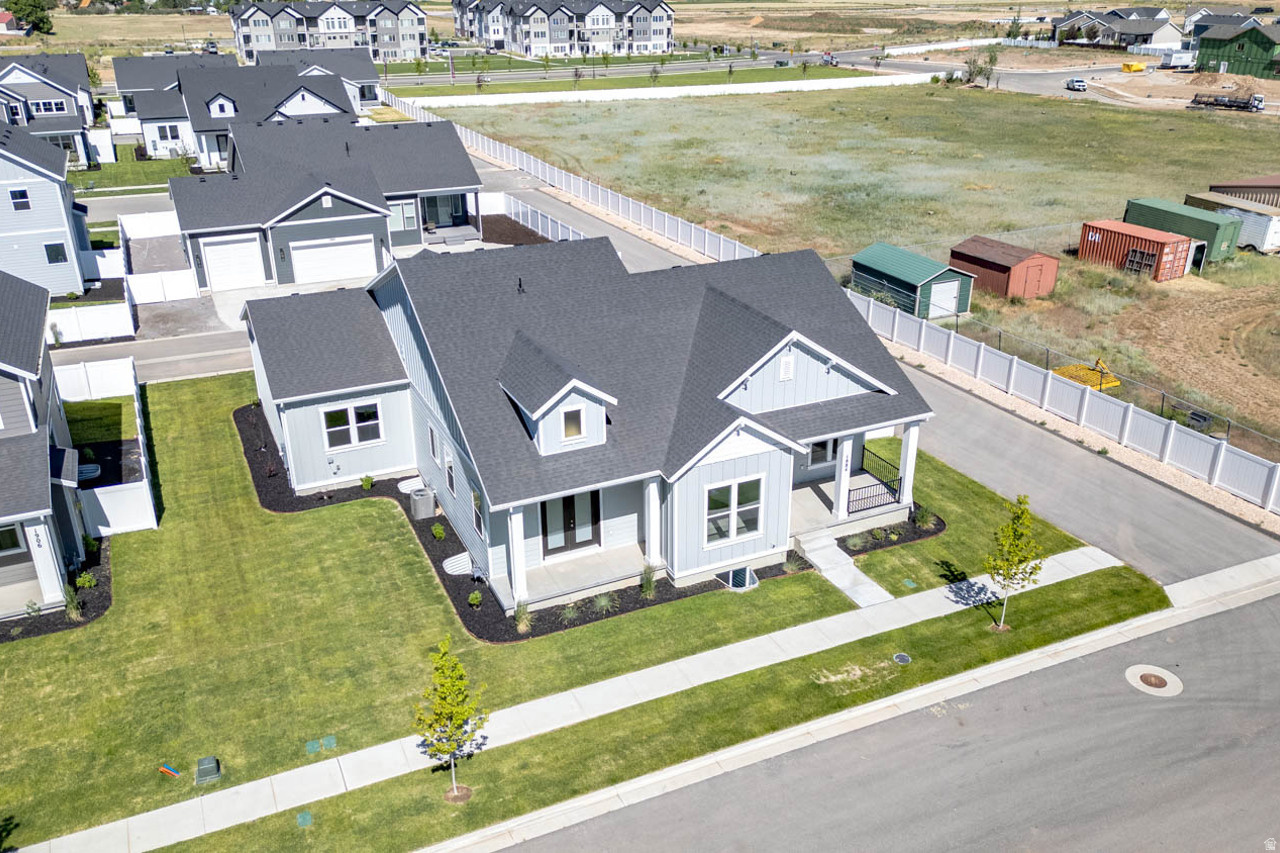 Sales Event! Receive $66,430 towards interest rate buy down and or closing costs with preferred lender. Refrigerator and window coverings also included!!!  Our beautiful Main floor living at its best. 10' ceilings on the main floor. ENORMOUS 3-car toy garage with extra height and 10'X10' opening. Enjoy the mountain views with 3 outdoor patio areas. The primary suite is a retreat with spa like bathroom and access from the primary closet into the laundry room. Taller ceilings in the basement offering a spacious family room, 1 bedroom and 1 bathroom.  Fully landscaped including a fenced backyard.  On one of the largest lots in the community.  Buyer to verify all.