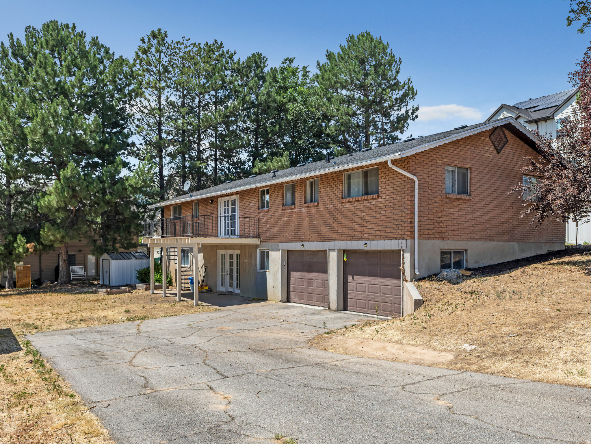 UPDATED MOVE IN READY RAMBLER! This Layton 5 Bd, 3Ba brick rambler sits on an expansive lot with .36 acres and is conveniently located close to 2 major roads (a block off Hwy 193 & less than 1 mile from I-15). The open spacious floorplan includes a newly remodeled kitchen, multiple living and entertaining zones, and a full ADU (accessory dwelling unit) in the basement. The ADU is complete with 2 spacious bedrooms, 1 bathroom, a full kitchen (new), separate access, and laundry (shared). Whether used as a long term rental to help offset your monthly mortgage, accommodations for extended family, or comfortable guest quarters, this ADU provides outstanding flexibility. This property would also be perfect for an investor/contractor due to its Multi-Family zoning status. You could rent out existing house while building duplex on the other half of the property.