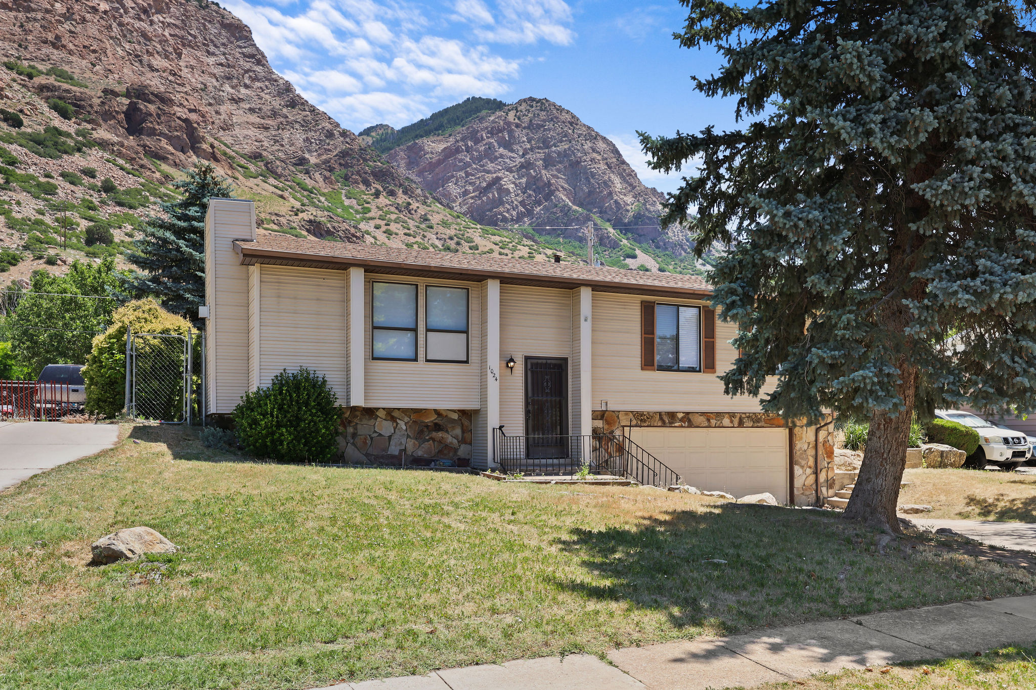 Welcome to this well-maintained 4-bedroom, 3-bath home located in a quiet Ogden neighborhood just minutes from Ron Claire Park. Offering 1,664 square feet of comfortable living space, this home features a unique layout with two master bedrooms, making it ideal for multi-generational living, guests, or added flexibility. Recent updates include a new roof, new central A/C, new plumbing, new water heater, new bathroom, and an updated basement, providing peace of mind for years to come. Enjoy outdoor living on the spacious deck with a pergola, perfect for relaxing or entertaining. Additional features include a 2-car garage and the rare convenience of two separate driveways, offering plenty of parking for vehicles, RVs, trailers, or guests. Conveniently located near parks, schools, shopping, and commuter routes, this property combines comfort, functionality, and value, with panoramic mountains, close to ski resorts and hiking trails. Buyer and buyer's agent to verify all information.