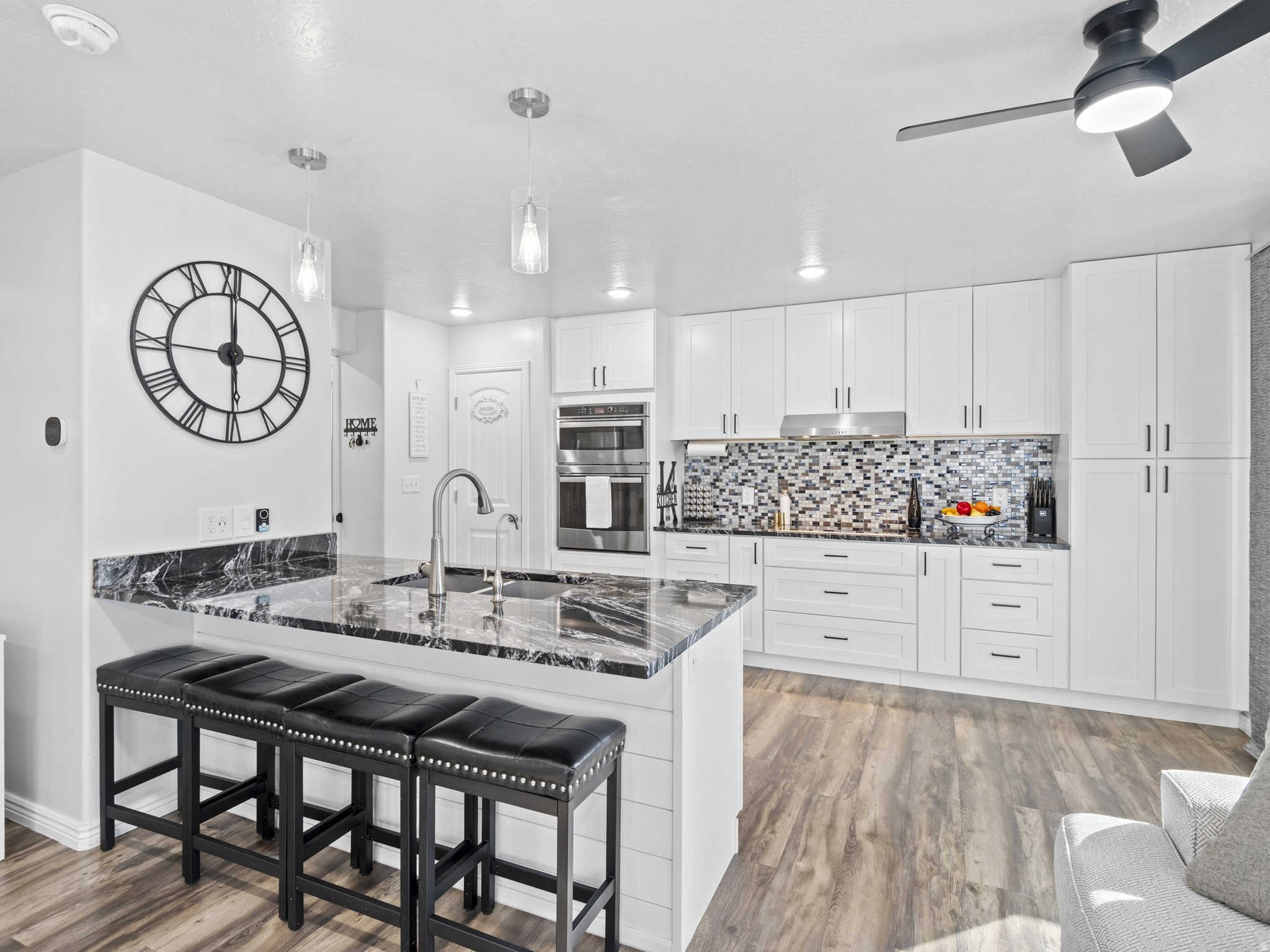 Come see this beautifully updated townhome in Spanish Fork! Featuring 4 bedrooms and 3.5 bathrooms, this home is in excellent condition and offers a rare blend of high-end upgrades, thoughtful design, and spacious, functional living.  As soon as you walk in, you'll notice the home's fresh, modern updates, stylish finishes, and bright, welcoming feel. The kitchen is the heart of the home, featuring beautiful white cabinets, upgraded granite countertops, brand-new stainless steel appliances, and a large peninsula perfect for meals, gathering, and entertaining. A built-in reverse osmosis system provides clean, high-quality drinking water. Step outside to your own spacious private deck, made for relaxing or entertaining year-round, complete with a retractable pergola and shade canopy for added comfort and style.  Enjoy a fresh, fully updated interior featuring brand-new carpet and flooring throughout, complemented by modern light fixtures. The home has been recently repainted, creating a clean feel in every room. Custom-made blackout honeycomb blinds on all windows add both style and energy efficiency. All windows are fitted with privacy mirror film, offering enhanced privacy while still allowing natural light in.    The fully finished basement is a standout feature, offering a private MOTHER-IN-LAW APT. This rare space includes a second kitchen with new appliances and is perfect for extended family or guests! The attached two-car garage features a brand-new opener with a track and plenty of overhead storage, offering endless flexibility for extra storage, a home gym, or even a fun hangout space with room for a kids' hammock setup.  This home provides easy access to all the amenities Spanish Fork has to offer for your family. Conveniently located minutes away from the hospital and the freeway!  Don't miss the chance to live a life of luxury-schedule your private tour today. Even better? All appliances are included!. This home is a MUST SEE!