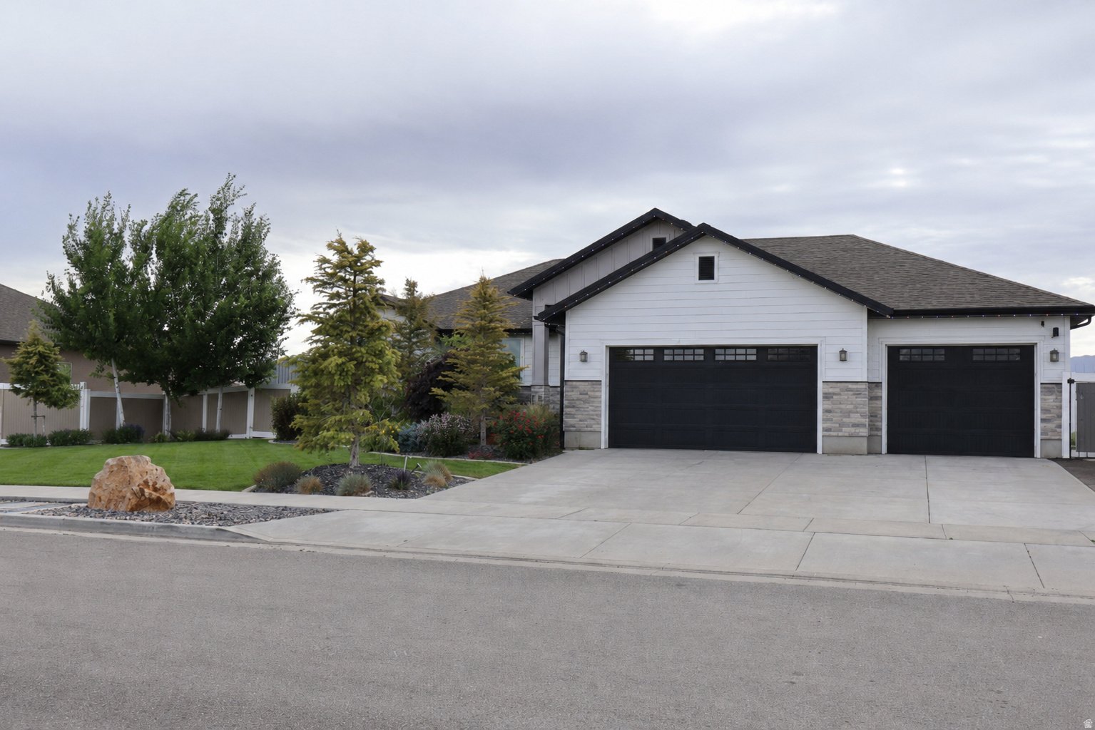 Beautiful move-in-ready home featuring 6 bedrooms and 4.5 bathrooms quartz countertops, stainless steel appliances, and a spacious layout with a walkout basement. The basement includes future plumbing for a second kitchen, perfect for a mother-in-law apartment. 240V wiring is available in both the attached garage and the detached garage. The property also offers an approximately 20x50 detached garage with future living space above. buyer to verify all information square footage figures are provided as a courtesy.