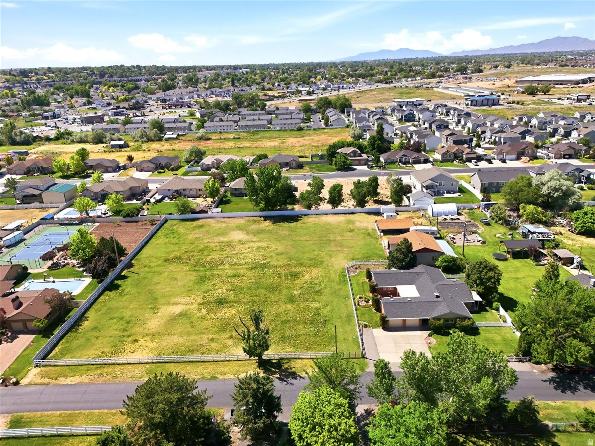 Executive Ranch style, one level living. Well maintained and updated. Full sprinklers and secondary irrigation for 2 acres. Barn w/office and workshop. Efficient and well planned upgraded kitchen. Multiple gathering places for entertaining. Real Wet Bar! Guests can R&R on east facing oversized patio. Square footage figures are provided as a courtesy estimate only and were obtained from Weber County.  Buyer is advised to obtain an independent measurement. Shown by appointment only.