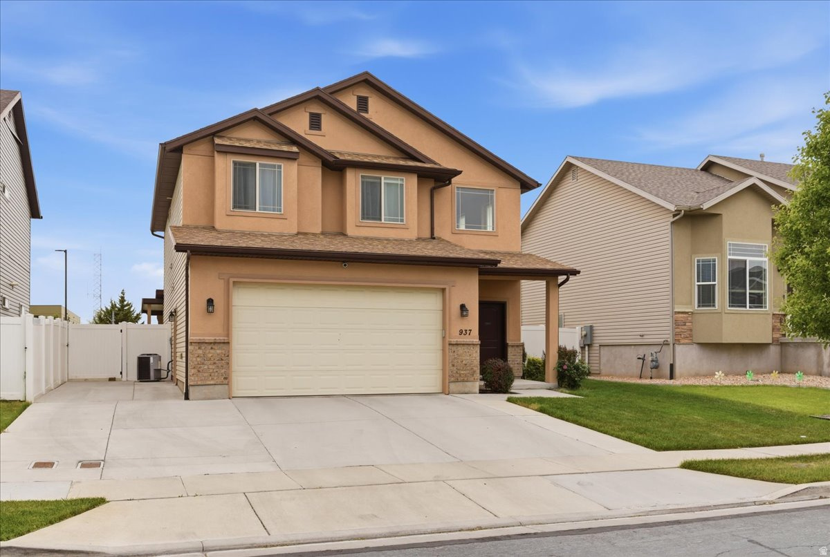 **Take advantage of lower monthly payments! Seller is offering a concession toward an interest rate buydown with an accepted offer at $575,000.** Beautiful open-concept home featuring a spacious primary suite with walk-in closet, open gathering space with gas fireplace, stainless steel gas appliances. Versatile loft space is perfect for an office, gym, playroom, or second living area. Enjoy outdoor living with a covered patio, power shade, and gas line for BBQ grill. Garage includes added hanging storage. Conveniently located near schools, shopping, restaurants, clinics, and just minutes from I-15, Legacy Parkway, and I-215. Within 15 minutes to SLC International airport, and downtown SLC.  Square footage figures are provided as a courtesy estimate only and were obtained from county records.  Buyer is advised to obtain an independent measurement.