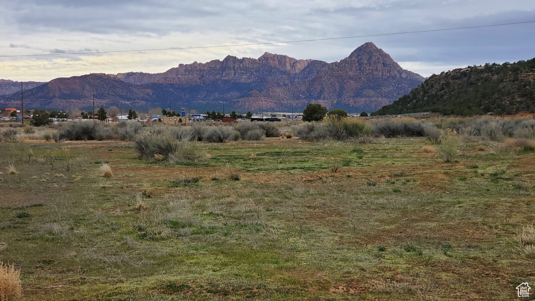 19.45 mostly flat acres with Amazing Zion views & endless potential. Located just off the highway near the gas station, this parcel boasts nearly a third of a mile of frontage-making it ideal for commercial development, residential subdivision, or equestrian use (previously used as a horse center)or Build your dream home on the south end by the other homes. Save the rest for later. 3 city wells + 3 water shares Power on-site Easy access year-round Just 12 miles to Hurricane, 30 miles to Zion & St. George, and 149 miles to Las Vegas Rumors of direct road to Zion coming. Million-dollar homes and major developments are going in all around it-now's the time to stake your claim. Visit applevalleyut.gov for planning and zoning details. Some ideas for use are: horse arena/boarding, retail spots, warehouses, light commercial/industrial, warehouses. (Less than 10k'), Solar farm, drive in theater. Tentatively approved...Paintball/ obstacle course, RV storage, Self storage-using shipping containers. Water is the main concern. Or build your dream house like so many are doing in the area!  Buyer to do their own due diligence.  Head East on state road 59 out of Hurricane. 12 miles Watch for the large For Sale sign with the Deadman Realty skeletons on it.  Make a right onto 1400 n Apple Valley Drive.  There is access to the property from that side. Walk around, check out the views. Put in an offer! It's that easy :-) Buyer to verify all information