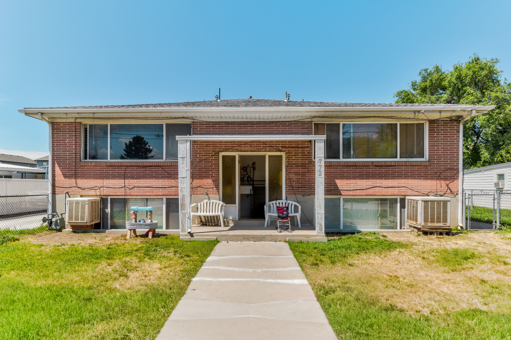 Exceptional investment opportunity on the highly desirable east side in Midvale! This all-brick fourplex has three spacious 2-bedroom, 1-bath units and one 1-bedroom, 1-bath unit. Major capital improvements have already been completed, including a brand-new roof in 2025, newer electrical breaker panels in all four units, updated interior plumbing in two units, a remodeled kitchen in one unit, and more.  Tenants enjoy the convenience of four garage spaces, ample parking, and two separate fenced outdoor areas that are perfect for pets, children, or private outdoor enjoyment. The durable brick exterior provides timeless curb appeal and low-maintenance ownership.  Located in a prime location with quick access to shopping, dining, recreation, major commuter routes, and nearby canyon access, this property offers an ideal combination of location, stability, and upside potential for investors seeking a quality multifamily asset.  See agent notes for important details.