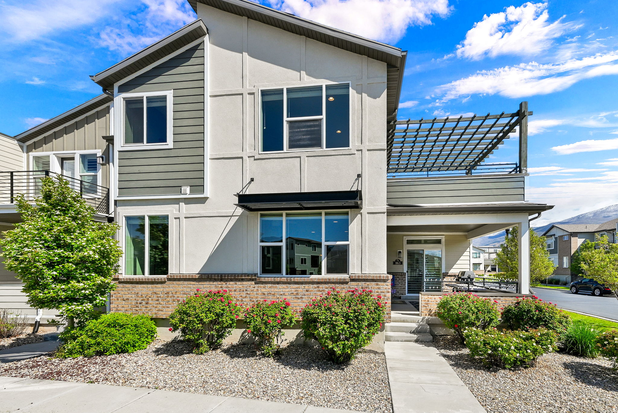 ***BACK ON THE MARKET DUE TO BUYER LOST HIS JOB & PRICE IMPROVEMENT***MAKE SURE YOU USE THE TOUR TAB*** and check out this beautiful home.  Location, comfort, and stress-free living! This coveted two-story townhouse end unit in Avenues at the Station is the 2366 sq. ft. Uniquely designed with the Primary Suite on the main floor, along with the main kitchen, large living room, and a half bath. The upper floor opens to an expansive great room including a "party kitchen" and a 13'x12' deck for relaxation and entertaining! Two additional large bedrooms, with a full bath, and laundry, complete the space. There is an Option to add a laundry hookup on the main floor for anyone who has one level living desires.  This home has the best lot in the subdivision, nestled near the guest parking lot and community pool. There is a greater distance from all the other homes, which offers extra privacy and stunning mountain views year-round. Just step out your door, the options are endless! Take a walk or cycle on the Denver and Rio Grande Western (D&RGW) Rail Trail, part of a 100-mile connecting trail system extending from Ogden to Provo! Or, enjoy Station Park's shopping, theater, and restaurants, University Health Center, and the Frontrunner. Less than 1 mile from Lagoon amusement park  you can walk or take a free shuttle available at Station Park. Your large private entry porch is plumbed with a gas line for your grill, and plenty of space for a picnic and BBQ. The Primary suite on the main floor has custom plantation shutters and its own private access to the front porch. The ensuite bathroom has a spacious walk-in closet and includes a GFI plug next to the toilet for a bidet seat. The main floor has engineered hardwood flooring and 9-foot ceilings. The large second-floor east-facing deck is shady in summer and, combined with the great room, creates an expanded entertainment space for your family and friends. New ceiling fans [2022], New paint [2024], New appliances [2025], Custom blinds throughout the home, Soft close cabinetry in the main kitchen and primary suite, Garage has epoxy floor coating, extra bright lighting, and ceiling-mounted storage shelves.  THIS IS A MUST SEE AT THIS UPDATED PRICE!